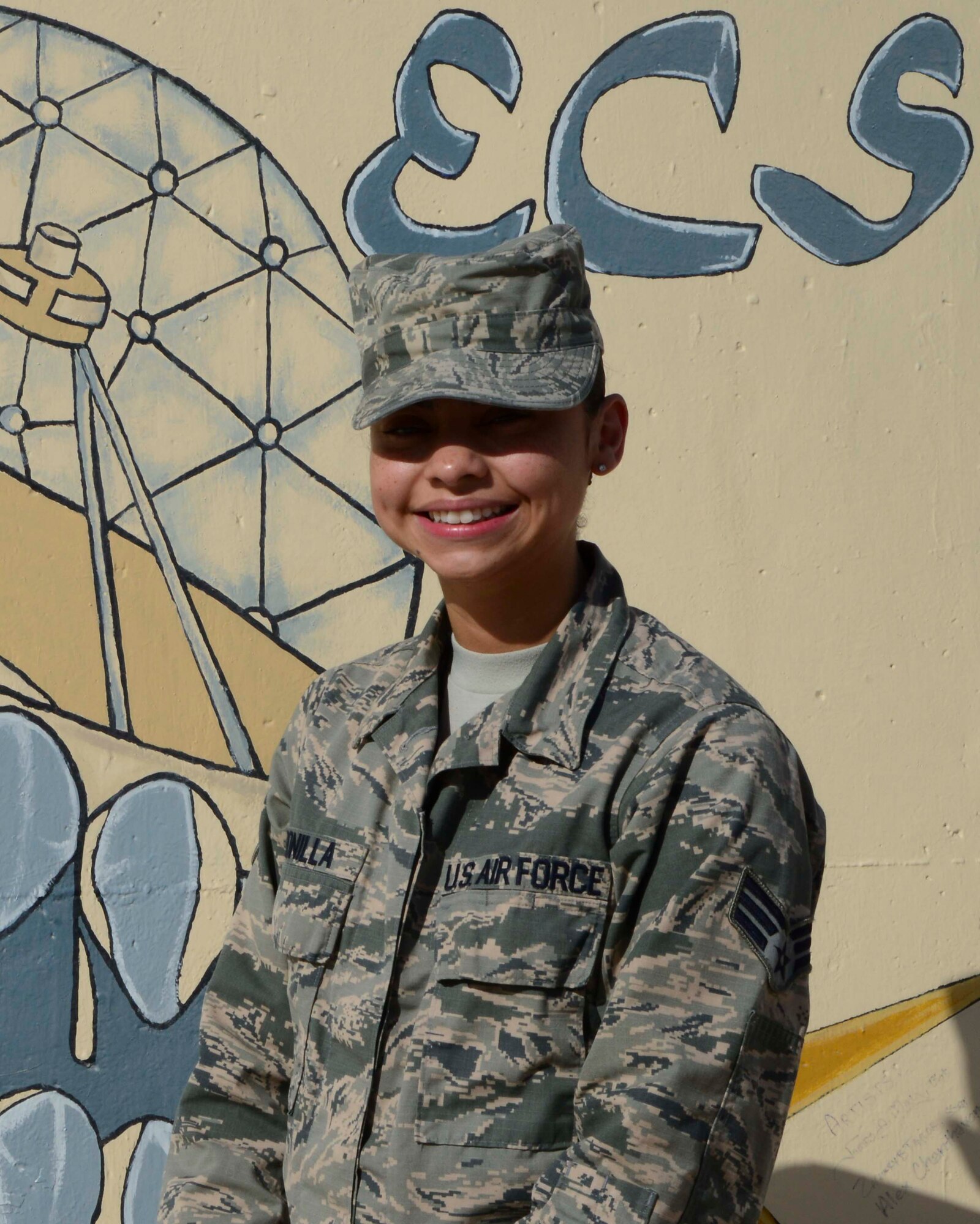 U.S. Air Force Senior Airman Sara Bonilla, 379th Expeditionary Communications Squadron focal point technician, received the Army Achievement Medal at Al Udeid Air Base, Qatar, Oct. 13, 2014. Bonilla worked to create, route and process trouble tickets for more than twenty computer requests for the 108th Air Defense Artillery Brigade during her first ten days assigned here. She is deployed from the 99th Communications Squadron at Nellis Air Force Base, Nevada and hails from Bridgeport, Connecticut. (U.S. Air Force photo by Staff Sgt. Ciara Wymbs) 