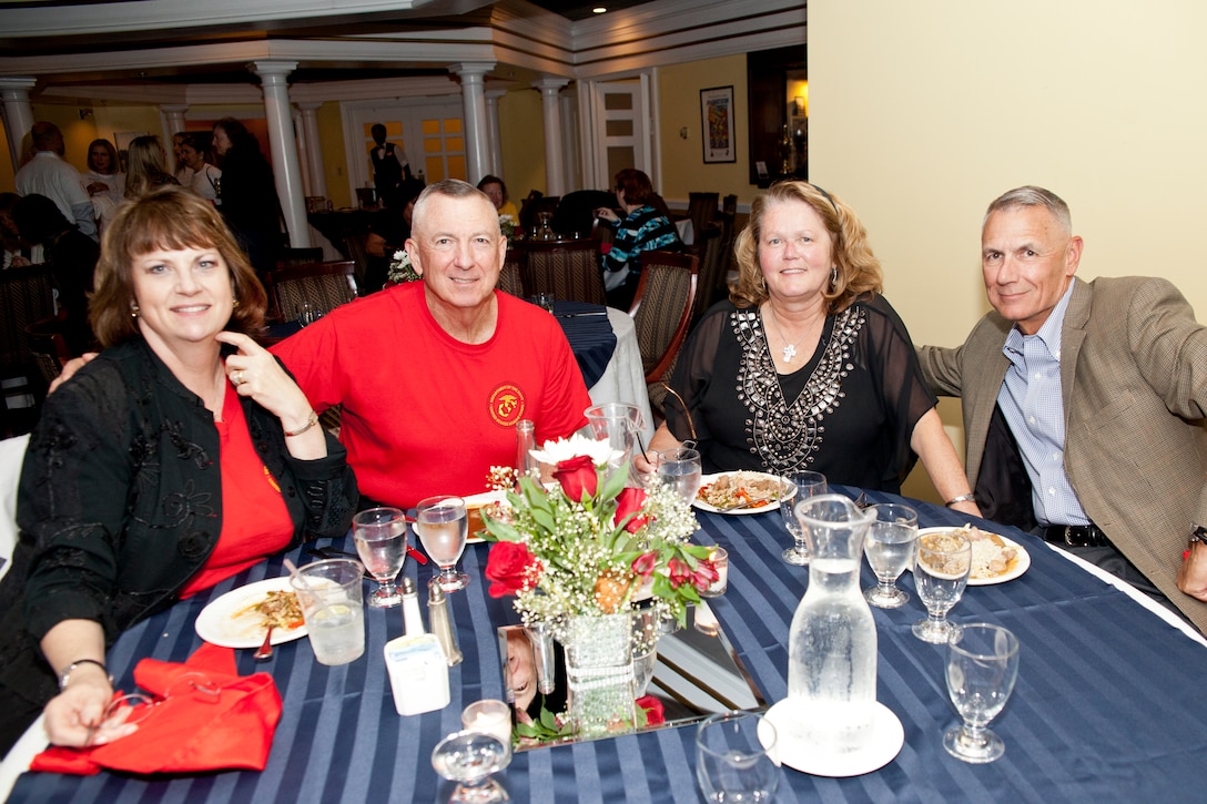 U.S. Marine generals and spouses pose at an evening social during a symposium at Marine Corps Base Quantico, Va., Oct. 21, 2014. Commandant of the U.S. Marine Corps Gen. Joseph F. Dunford, Jr. hosted the 2014 General Officer Symposium for all Marine generals, admirals, senior executive services and their spouses. (U.S. Marine Corps photo by Sgt. Gabriela Garcia/Released)