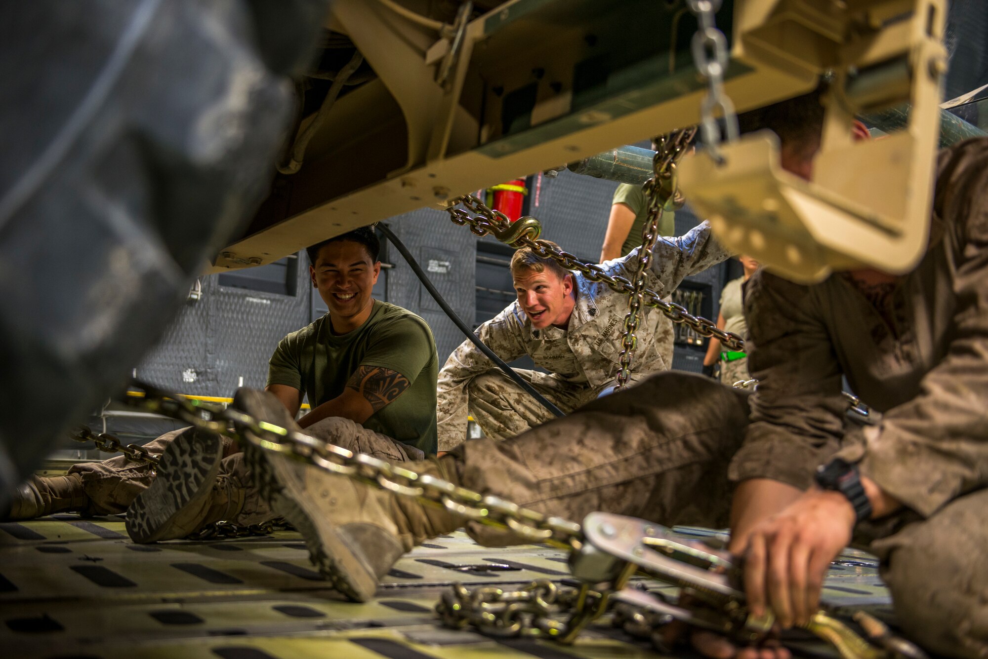 Marines from the Marine Expeditionary Brigade load vehicles into a C-5M Super Galaxy Oct. 6, 2014, at Camp Bastion, Afghanistan. Airmen and Marines loaded more than 266,000 pounds of cargo onto the C-5M as part of retrograde operations in Afghanistan. During this mission, the crew reached more than 11 million pounds of cargo transported in a 50-day period. (U.S. Air Force photo by Staff Sgt. Jeremy Bowcock)