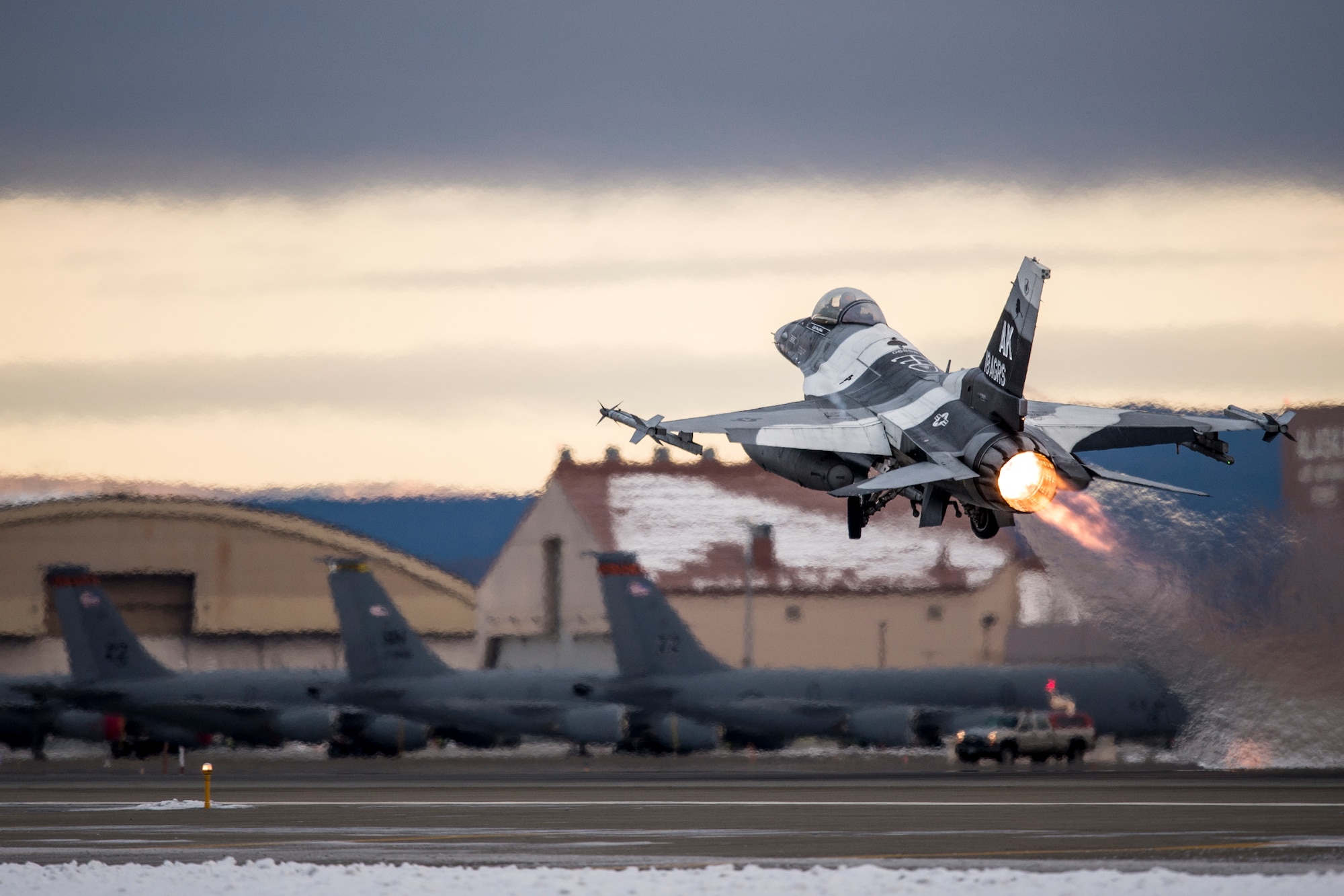 An F-16 Fighting Falcon takes off Oct. 15, 2014, at Eielson Air Force Base, Alaska, during Red Flag-Alaska 15-1. The Pacific Air Forces commander-directed field training exercises for U.S. and partner nation forces provide combined offensive counter-air, interdiction, close air support and large force employment training in a simulated combat environment. The F-16 is assigned to the 18th Aggressor Squadron at Eielson AFB. (U.S. Air Force photo/Senior Airman Peter Reft)