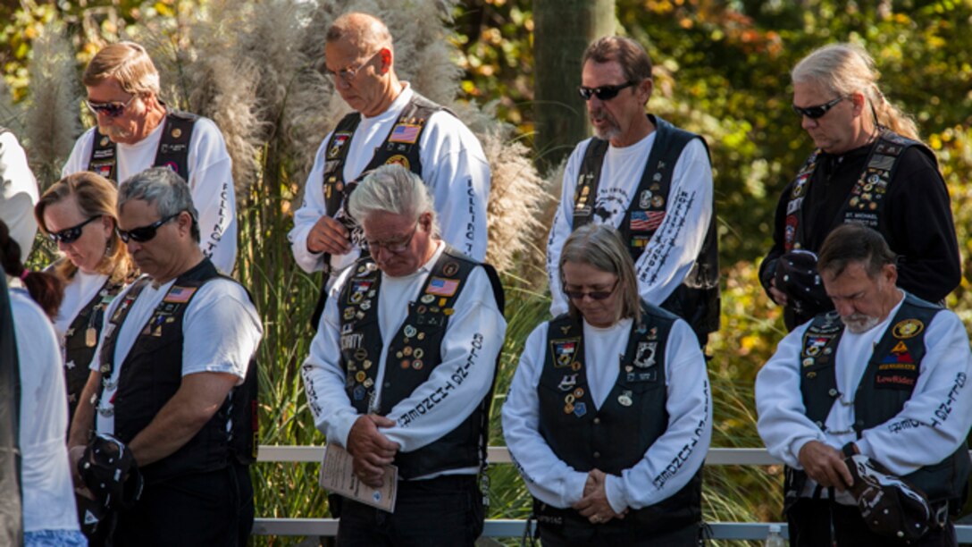 Members of Rolling Thunder pray during the 31st Beirut Memorial Observance Ceremony at the Beirut Memorial, Jacksonville, N.C., Oct. 23, 2014. Each year, a memorial observance takes place on October 23rd to remember those lives lost at the Beirut barracks bombing in Beirut, Lebanon. (U.S. Marine Corps photo by Lance Cpl. Judith L. Harter, MCI-East Combat Camera, MCI-East/Released)