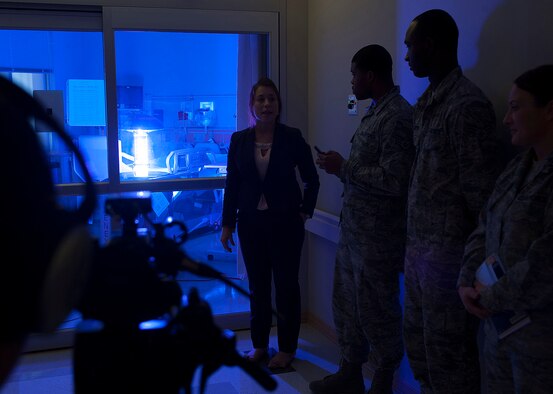 Geri Genant, left, demonstrates the capabilities of “Saul”, a germ-zapping robot, to Airmen Oct. 20, 2014, at Joint Base Langley-Eustis, Va. The 633rd Medical Group partnered with Xenex Healthcare Services, Saul’s creator of the robot in effort to provide a safer healthcare facility for the Langley community. Genant is the Xenex Healthcare Services implementation manager. (U.S. Air Force photo/Staff Sgt. Antoinette Gibson)