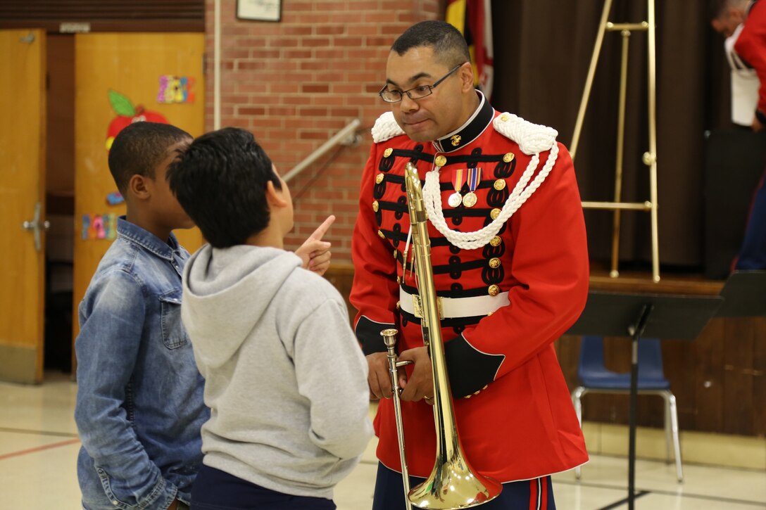 On Oct. 16, 2014, a brass quintet from "The President's Own" including trumpet/cornet players Gunnery Sgt. Robert Singer and Staff Sgt. Benjamin Albright, French horn player Staff Sgt. Timothy Huizenga, trombone player Staff Sgt. Christopher Reaves, and tuba player Staff Sgt. Simon Wildman, performed a Music in the Schools program at Mt. Rainier Elementary School in Mt. Rainier, Md. (U.S. Marine Corps photo by Master Sgt. Kristin duBois/released)