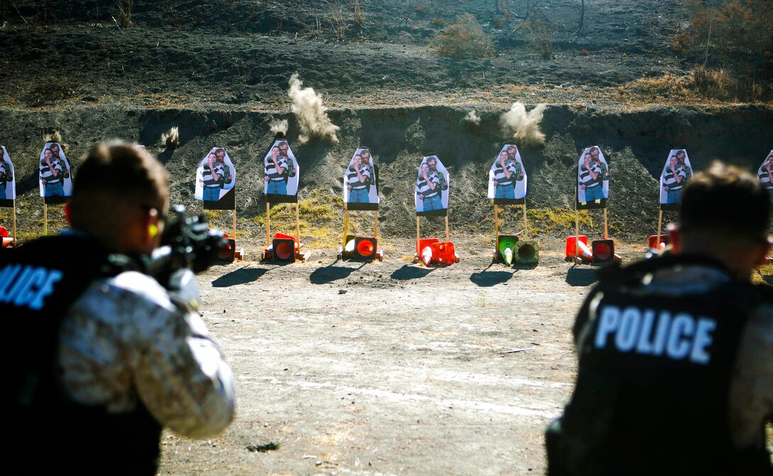 CAMP PENDLETON, Calif. - Marines with the Provost Marshall Office's Special Reaction Team, engage targets holding hostages during a live-fire training evolution at Range 300, Oct. 23.  The SRT is responsible for any critical situations that fall beyond the capabilities of ordinary law enforcement. (U.S. Marine Corps photo by Cpl. Keenan Zelazoski)