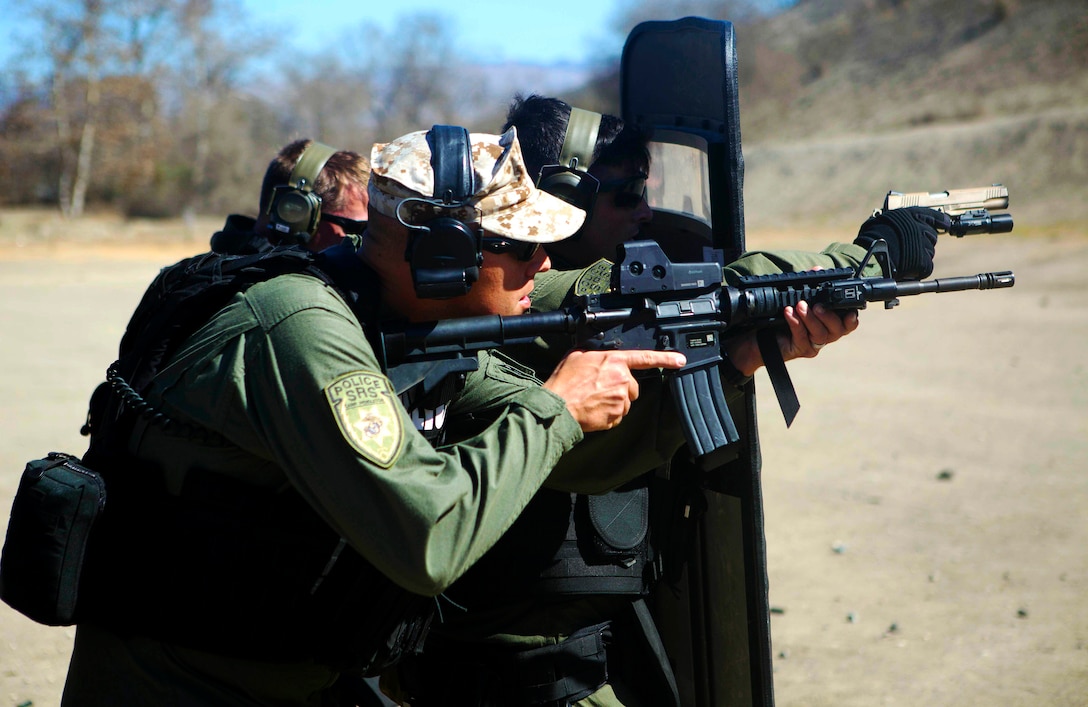 CAMP PENDLETON, Calif. - The Provost Marshall Office's Special Reaction Team conducts the avalanche drill at Range 300, Oct. 23.  The avalanche drill is a technique to tactically withdraw in the event the team is overrun by an enemy. (U.S. Marine Corps photo by Cpl. Keenan Zelazoski)