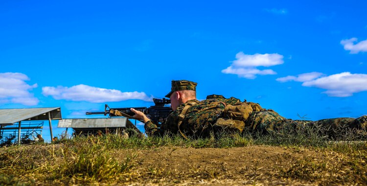A recruit of Mike Company, 3rd Recruit Training Battalion, practices the marksmanship fundamentals of the prone position during Grass Week at Edson Range, Marine Corps Base Camp Pendleton, Calif., Oct. 15. Grass Week taught recruits the basic fundamentals of marksman shooting skills and also to learn the functions of the rifle such as how to load, unload and fire the M16-A4 service rifle.
