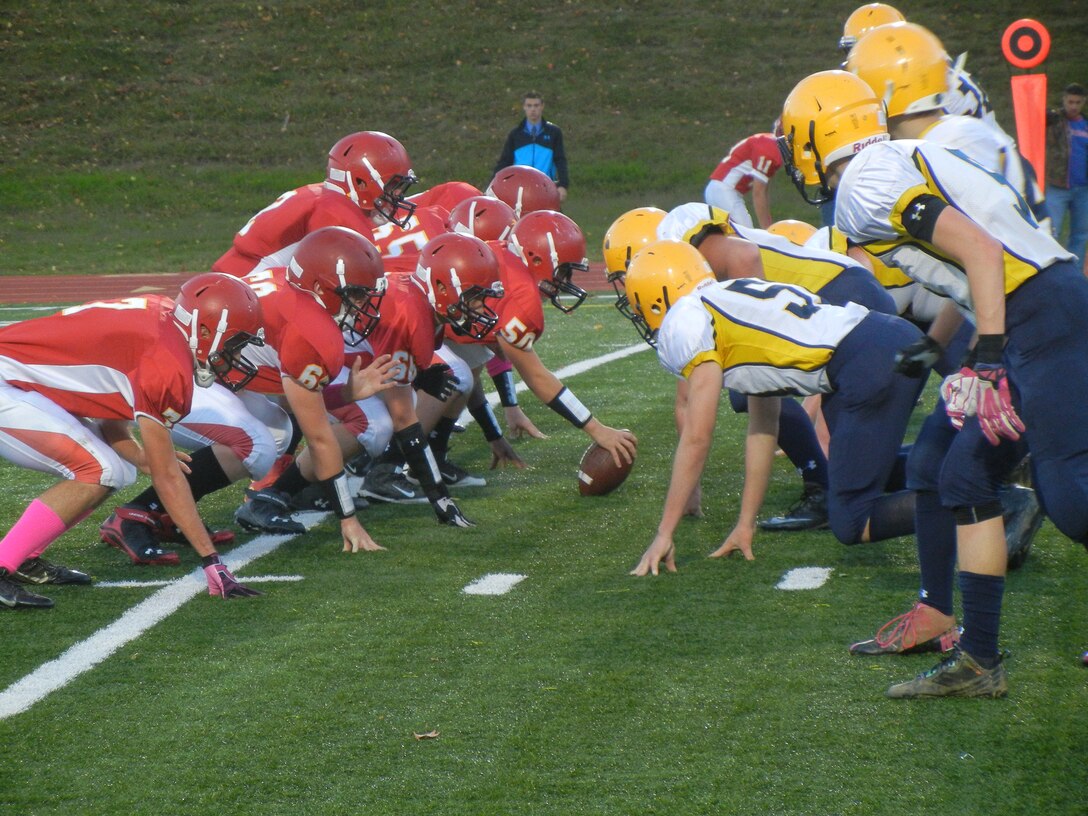 Quantico Middle/High School quarterback T.J. prepares to take the snap during Friday’s Homecoming game at Butler Stadium against Rappahannock County. The Warriors won 19-7.
