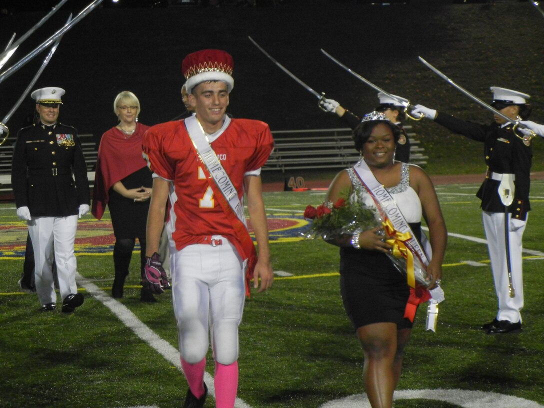 Homecoming King Stephen and Queen Aonjhne make their way to the sidelines during the halftime festivities of Friday’s Homecoming game at Butler Stadium against Rappahannock County. The Warriors won 19-7.