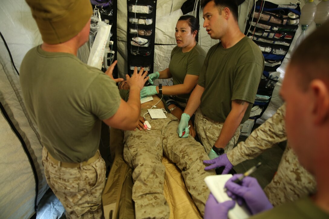 Seaman Gregory Miles, Shock Trauma Platoon, 15th Marine Expeditionary Unit, role-plays as an injured combatant during Final Exercise I of the Weapons and Tactics Instructors Course at Sandy Hills, Combat training area, Oct. 14, 2014. The STP practiced emergency medical treatment on 12 role-players with a variety of different injuries.