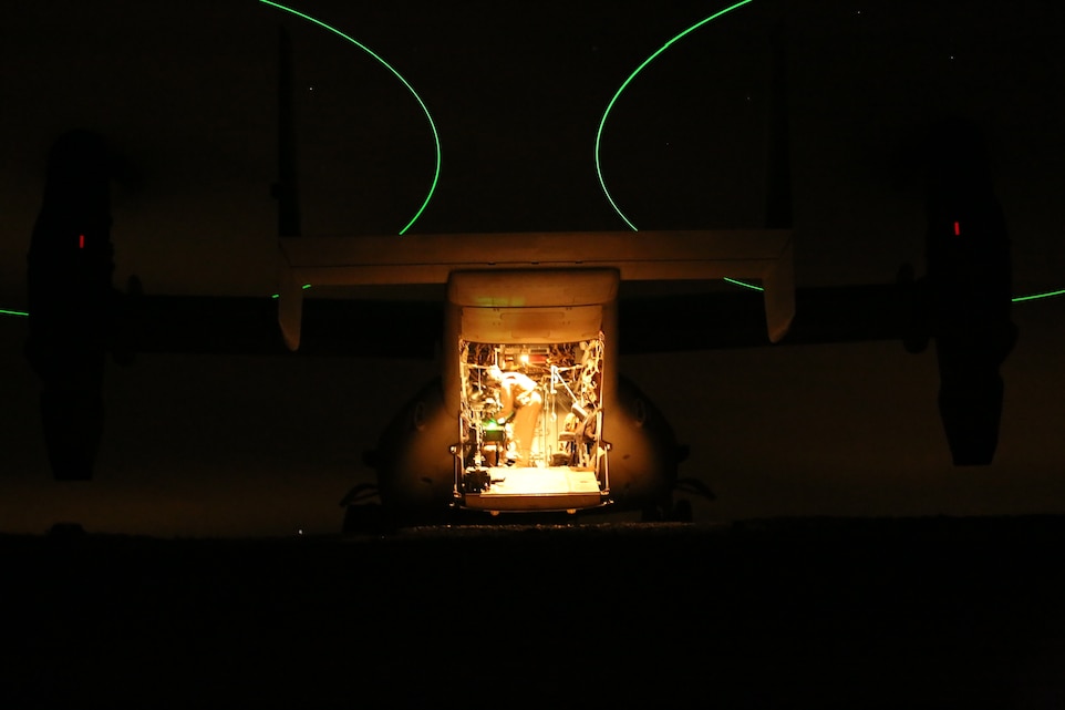 A crewmember of an MV-22 Osprey prepares the aircraft for transport to Marine Corps Air Station Yuma, Ariz., after landing near the medical tent of the Shock Trauma Platoon, 15th Marine Expeditionary Unit, during Final Exercise I of the Weapons and Tactics Instructors Course at Sandy Hills, Combat Center training area, Oct. 14, 2014. The STP sent three role-players back to MCAS Yuma to represent casualties with severe injuries.