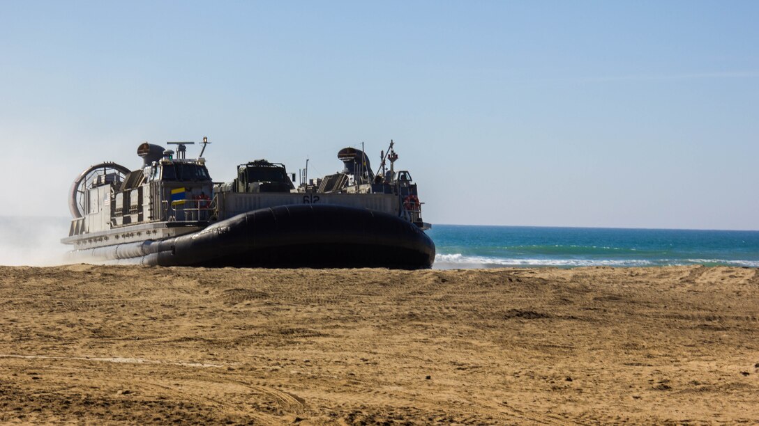 A Landing Craft, Air Cushions assigned to Assault Craft Unit 5 while makes a beach landing while performing a ship-to-shore drill during exercise Pacific Horizon 2015 aboard Marine Corps Base Camp Pendleton, Calif., Oct 23. PH 15 is a scenario driven, simulation supported crisis response exercise designed to improve 1st Marine Expeditionary Brigade's and Expeditionary Strike Group 3's interoperability and strengthen Navy-Marine Corps relations by conducting an in-stream Maritime Prepositioning Force offload of equipment by providing host country civil-military security assistance, and by conducting infrastructure restoration support from Oct. 20-28. 