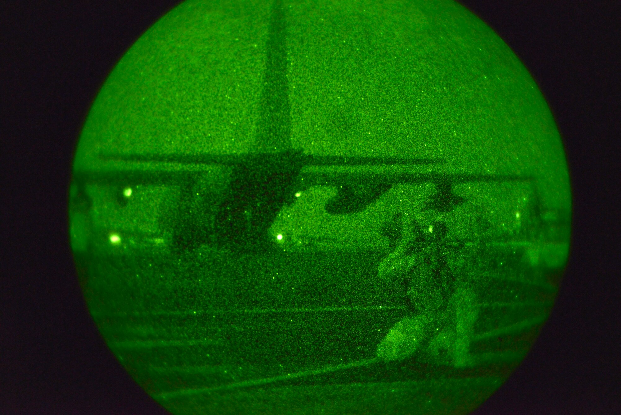 An Army Ranger from the 2nd Battalion, 75th Ranger Regiment stationed at Joint Base Lewis-McChord, Wash., stands guard as other members board a C-130 Hercules during a joint exercise on the flightline Oct. 15, 2014, at Fairchild Air Force Base, Wash. (U.S. Air Force photo/Airman 1st Class Janelle Patiño)