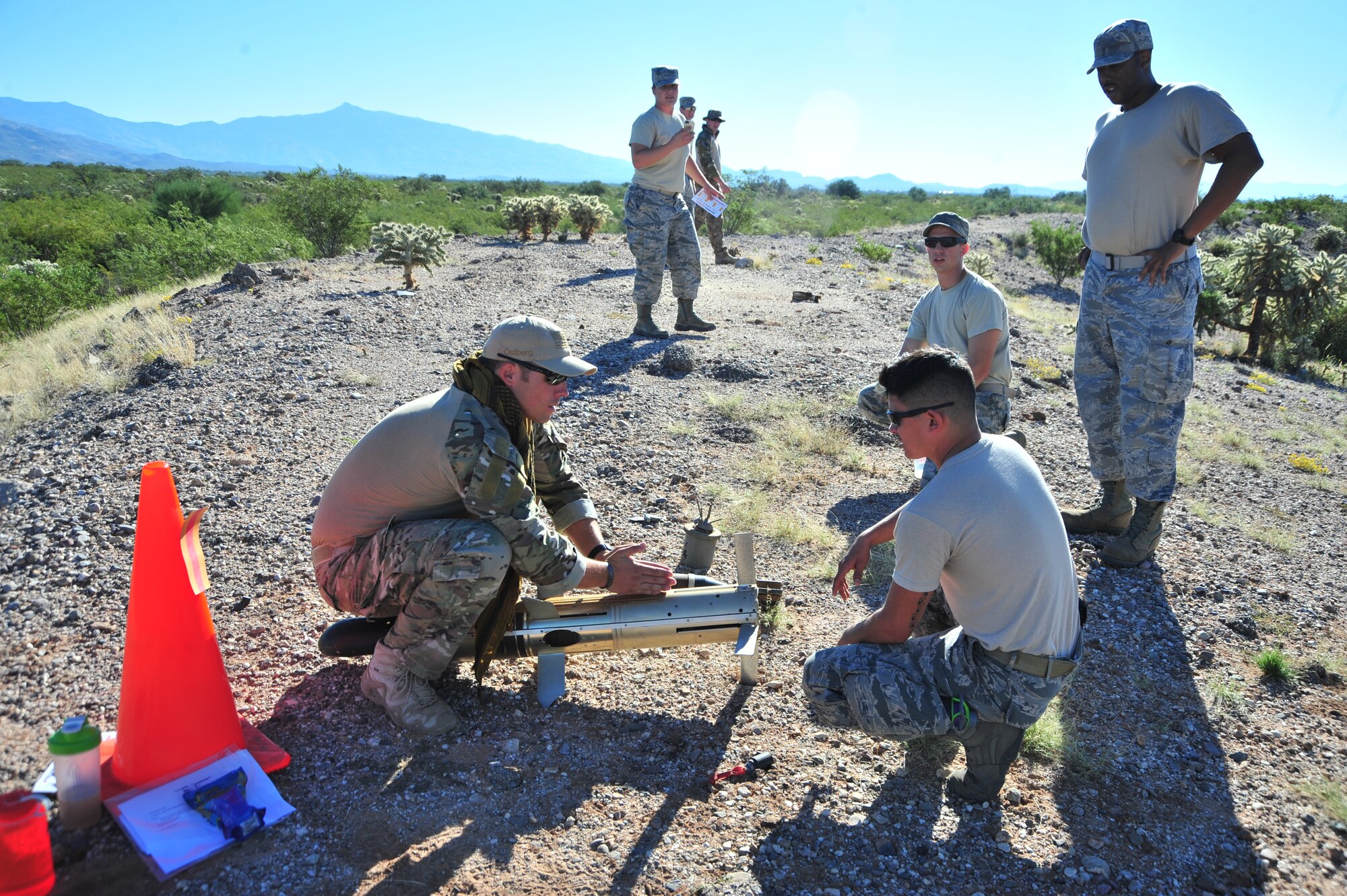 U.S. Air Force Senior Airman Jose Parra, 355th Civil Engineer Squadron Explosive Ordnance Disposal Flight journeyman, identifies ordnance in order for his team to move on during an exercise at Davis-Monthan Air Force Base, Ariz., Oct. 23, 2014.  Many of the skills needed to complete the exercise tested the participants’ wartime and contingency skillsets learned in previous training sessions. (U.S. Air Force Photo by Airman 1st Class Chris Massey/Released)