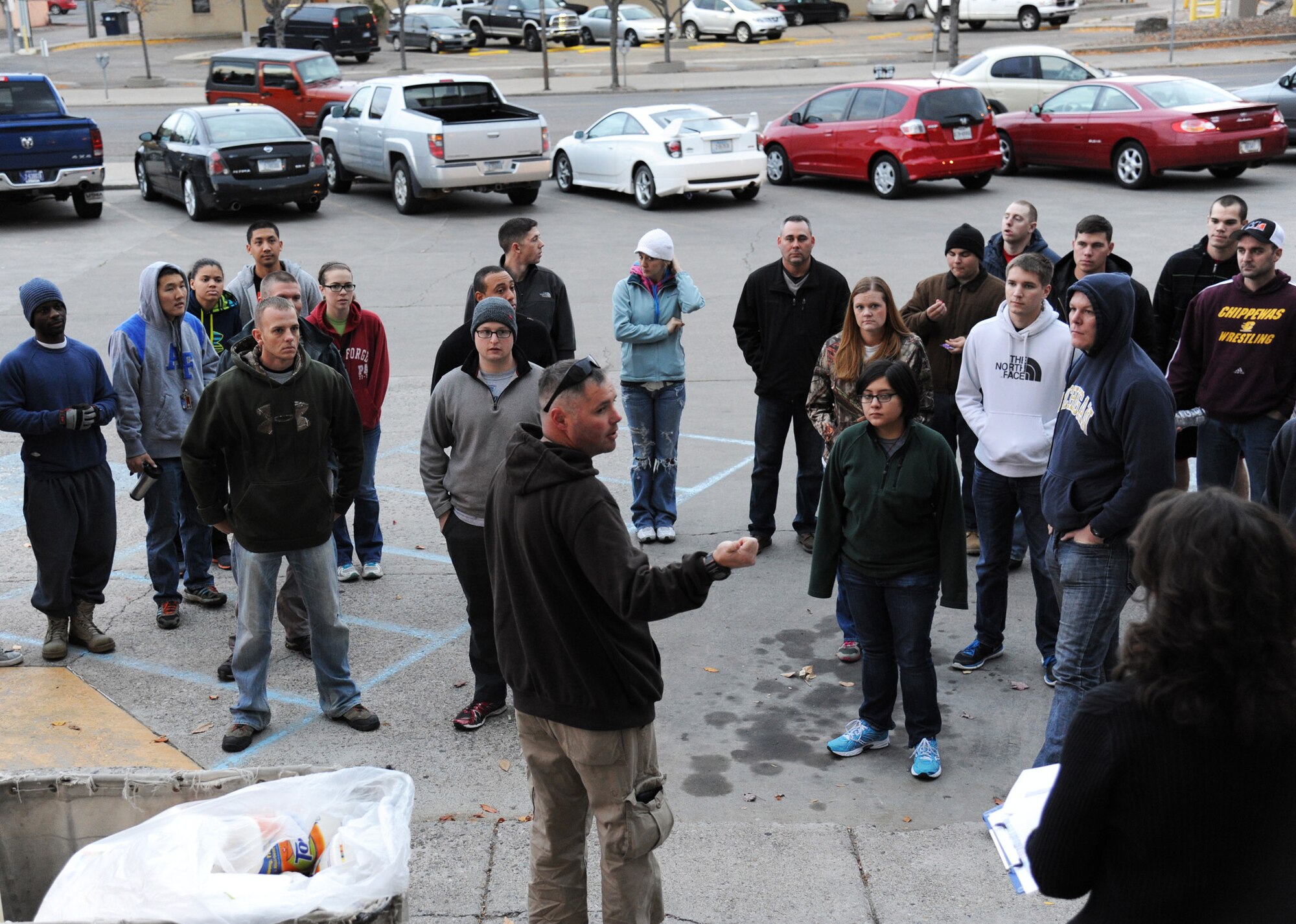 Master Sgt. Jim Ulrich, 12th Missile Squadron superintendent, center, speaks to nearly 50 volunteers at the main Post Office parking lot in Great Falls, Mont., the morning of Oct. 24. The volunteers, made up of members from Malmstrom Air Force Base and other federal employees, participated in the Day of Caring as part of the Combined Federal Campaign. (U.S. Air Force photo/Christy Mason)