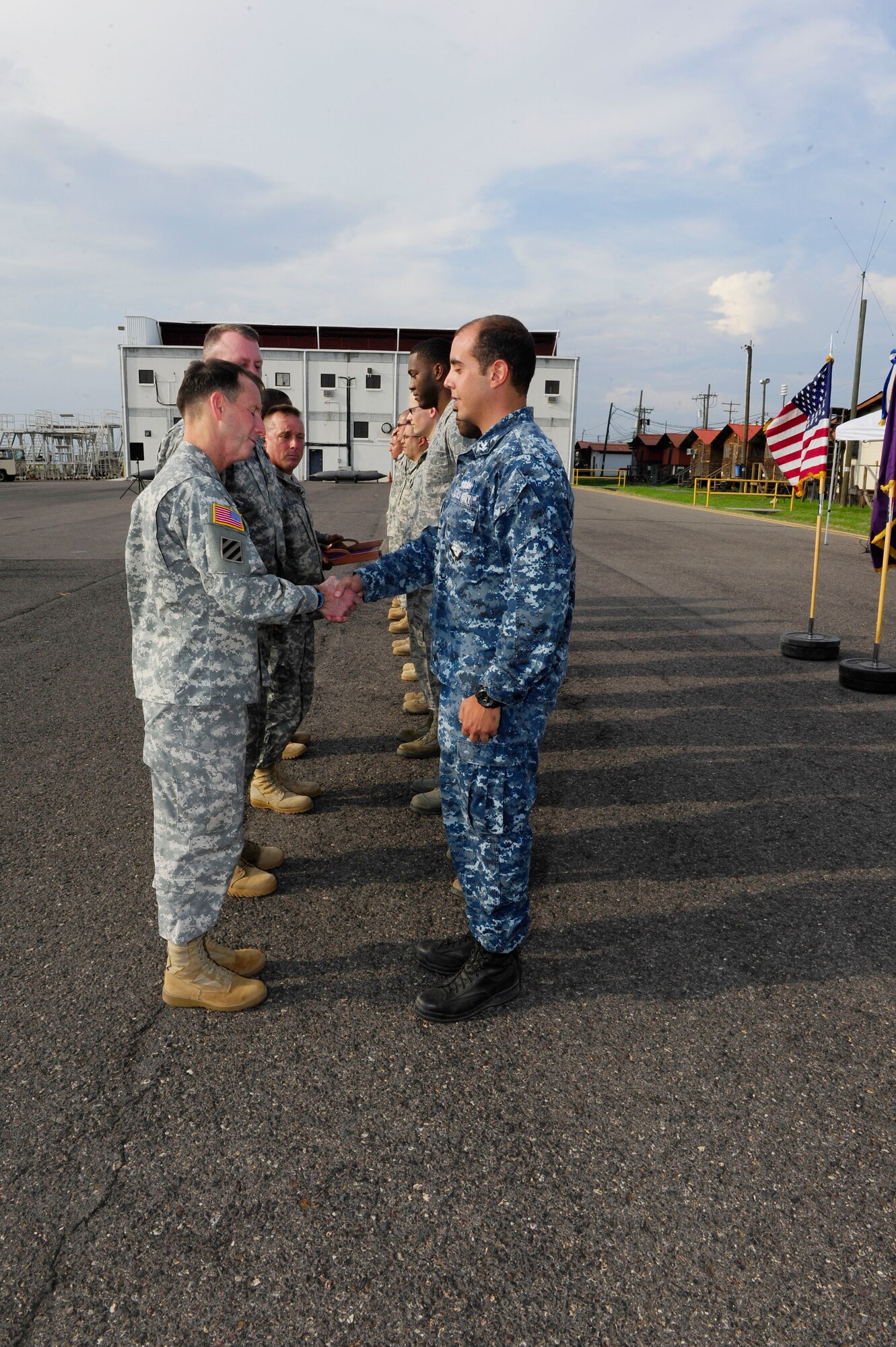 At the end of his tour, Maj. Gen. Joseph P. DiSalvo awarded 10 Joint Task
Force-Bravo service members with the Army Achievement Medal and the Army
South Commanding General coin for their outstanding performance during their tenure at Soto Cano Air Base, Honduras, Oct.21, 2014. (Photo by Martin Chahin)  
