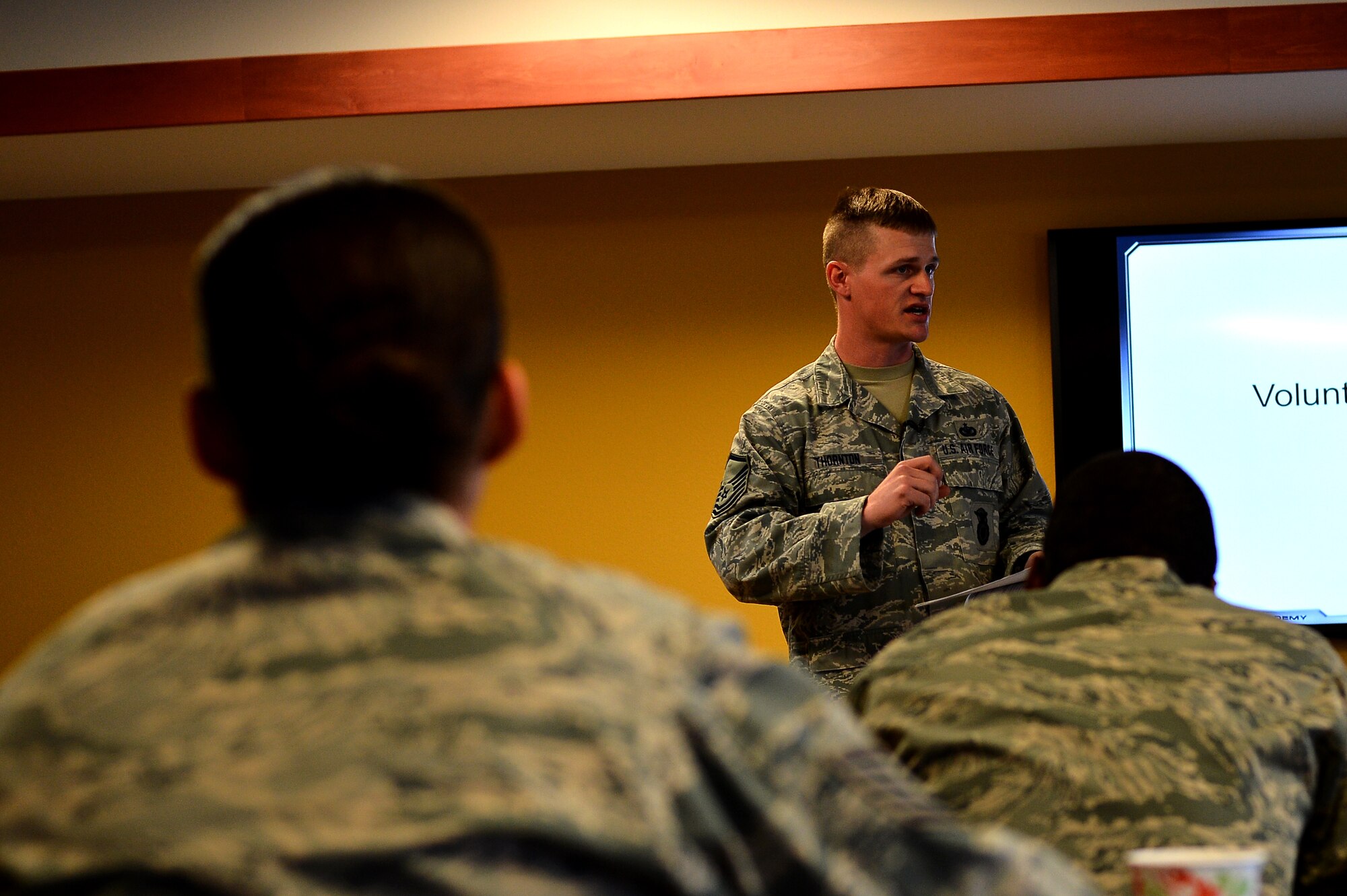 Master Sgt. Joshua Thornton, 140th Security Forces Squadron TASER master instructor, teaches security forces members during their Conducted Electronic Weapons training Oct. 23, 2014, at the 140th SFS building on Buckley Air Force Base, Colo. CEW training is designed to educate law enforcement members on when and how to use non-lethal force in stressful situations. (U.S. Air Force photo by Senior Airman Darren Scott/Released)