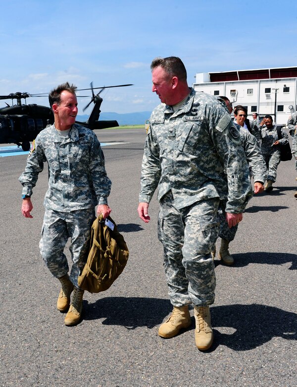 Maj. Gen. Joseph P. DiSalvo, U.S. Army South Commanding General, was greeted by Col. Kirk Dorr, Joint Task Force-Bravo Commander, and Col. Rollin Miller, Army Support Activity Commander, on the flightline at Soto Cano Air Base, Honduras, Oct. 21 2014. Maj.
Gen. DiSalvo visited different areas of the post to learn more about the continued efforts to upgrade infrastructure and to recognize personnel for their accomplishments (Photo by Martin Chahin)
