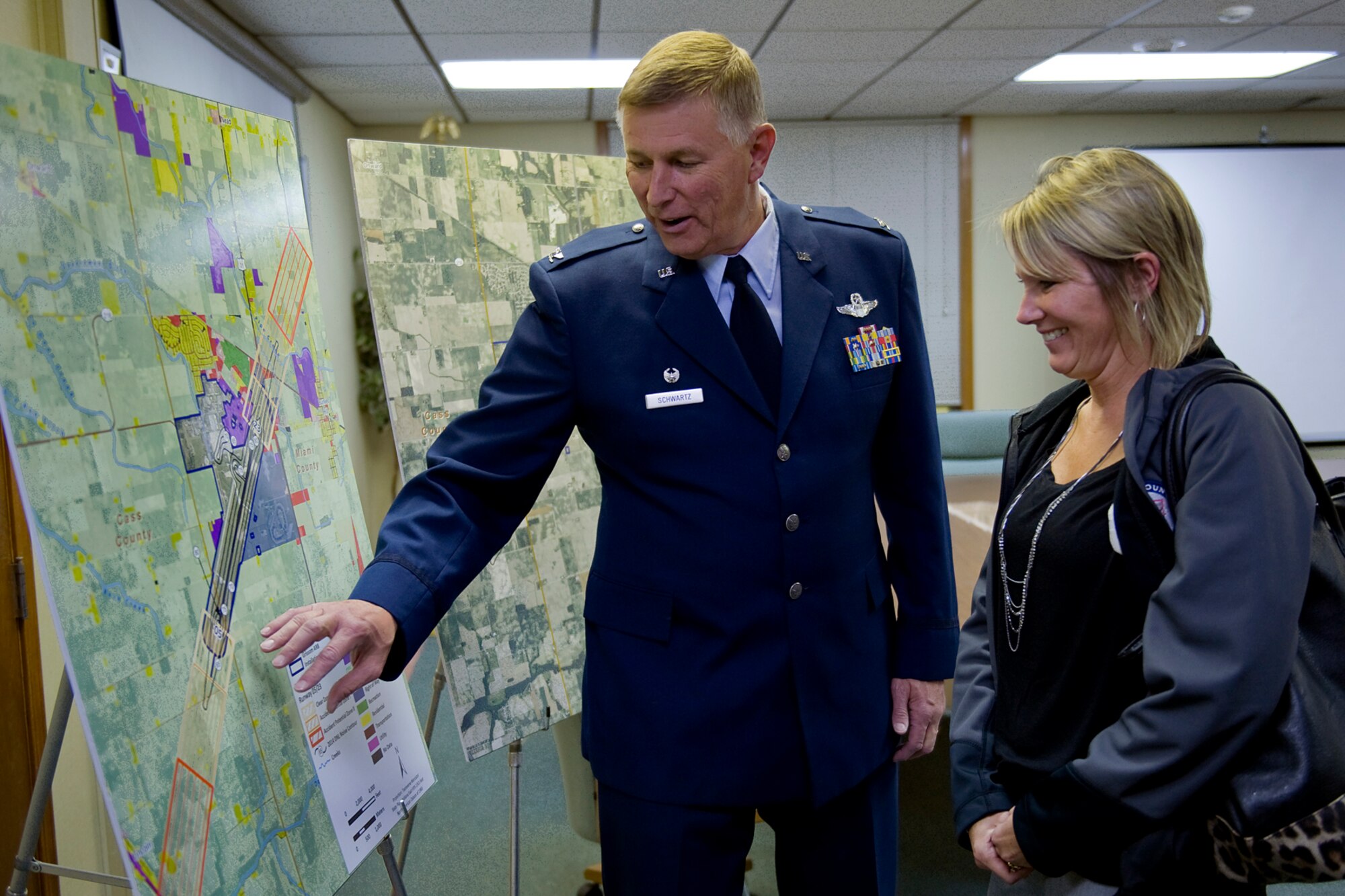 Col. Doug Schwartz, 434th Air Refueling Wing commander, speaks with Christy Householder, Cass County director of economic development, about the results of a recently released air installation compatible use zone study during a public meeting in Peru, Ind., Oct. 23, 2014. During the meeting, the AICUZ results showed that Grissom's noise contour levels above 65 decibels had reduced by 20 percent when compared to the last study done in 1995. (U.S. Air Force photo/Mark R. W. Orders-Woempner)
