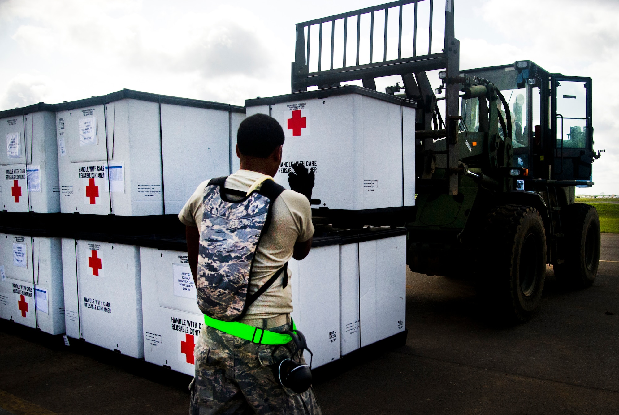 ROBERTS INTERNATIONAL AIRPORT, Republic of Liberia - U.S. Air Force Airmen part of the Joint Task Force-Port Opening team of the 621st Contingency Response Wing assigned to Joint Base McGuire-Dix-Lakehurst, N.J., finish unloading medical supplies during Operation UNITED ASSISTANCE here, October 16, 2014. The JTF-PO is supporting a comprehensive U.S. government effort led by the U.S Agency for International Development, to support the World Health Organization and other international partners to help the Governments of Guinea, Liberia, and Sierra Leone respond to and contain the outbreak of the Ebola virus in West Africa. (U.S. Air Force photo/Staff Sgt. Gustavo Gonzalez/RELEASED)
