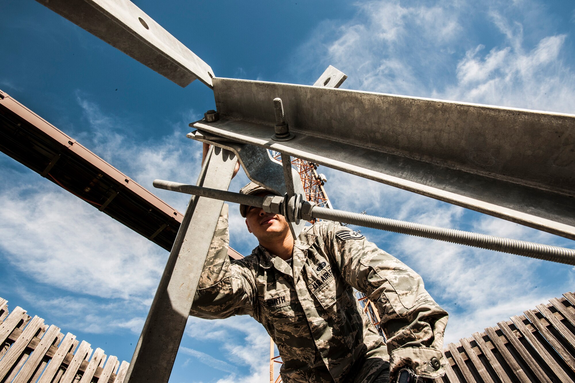 Staff Sgt. Andrew Smith, 89th Communications Squadron program manager, inspects a work site where 89th CS Airmen are installing two antennas. The antennas are used as part of a system, which enables communication aboard 89th Airlift Wing planes, supporting America’s top five civilian and military leaders, and Smith, a Hinesville, Ga., native ensures these projects are managed flawlessly. (U.S. Air Force photo/ Master Sgt. Kevin Wallace)