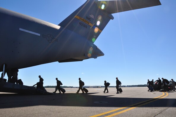Airmen from the 315th Airlift Wing at Joint Base Charleston, S.C. board a C-17 Globemaster III aircraft for a four-day training mission in Key West Fla. Oct. 17, 2014. The four-day training mission included 117 members from the 315th AW and was part of the wing’s Unit Effectiveness Inspection training, which is the U.S. Air Force’s new way of evaluating a unit’s wartime, contingency and force sustainment readiness. (U.S. Air Force Photo by Staff Sgt. Bobby Pilch)