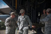 (Left to right) Staff Stg. Nick Yankosky, Staff Sgt. Jessica Rumsley, Staff Sgt. Vanessa Barton and Staff Sgt. Jocelyn Frenyea, 937th Training Support Squadron Medical Readiness Training Center instructors, demonstrate how to unload a patient from a C-130 Hercules during a 502nd Air Base Wing Honorary Commanders’ Immersion Tour Oct. 10, 2014 at Joint Base San Antonio-Camp Bullis. Honorary commanders toured locations at JBSA-Lackland and JBSA-Camp Bullis to get a better understanding of the missions that take place at the two locations, and to build a stronger bond between the local community and the military. (U.S. Air Force photo by Airman 1st Class Stormy Archer/Released)