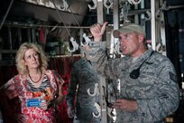 Joyce Brown, 502nd Air Base Wing honorary commander, listens to Tech. Sgt. Thomas Humphreys, 937th Training Support Squadron Aeromedical Evacuation Patient Staging course supervisor, while he gives a tour of a C-130-Hercules, which has been converted into a medical training platform, during an Honorary Commanders’ Immersion tour Oct. 10, 2014. Honorary commanders toured locations at JBSA-Lackland and JBSA-Camp Bullis to get a better understanding of the missions that take place at the two locations, and to build a stronger bond between the local community and the military. (U.S. Air Force photo by Airman 1st Class Stormy Archer/Released)