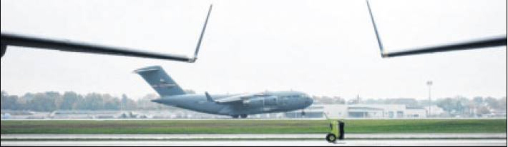 A C-17 Globemaster III from the 445th Airlift Wing departs from Wright-Patterson Air Force Base Oct. 16 to deliver cargo in support of Ebola stricken regions of West Africa. (Air Force photo by Ted Theopolos)