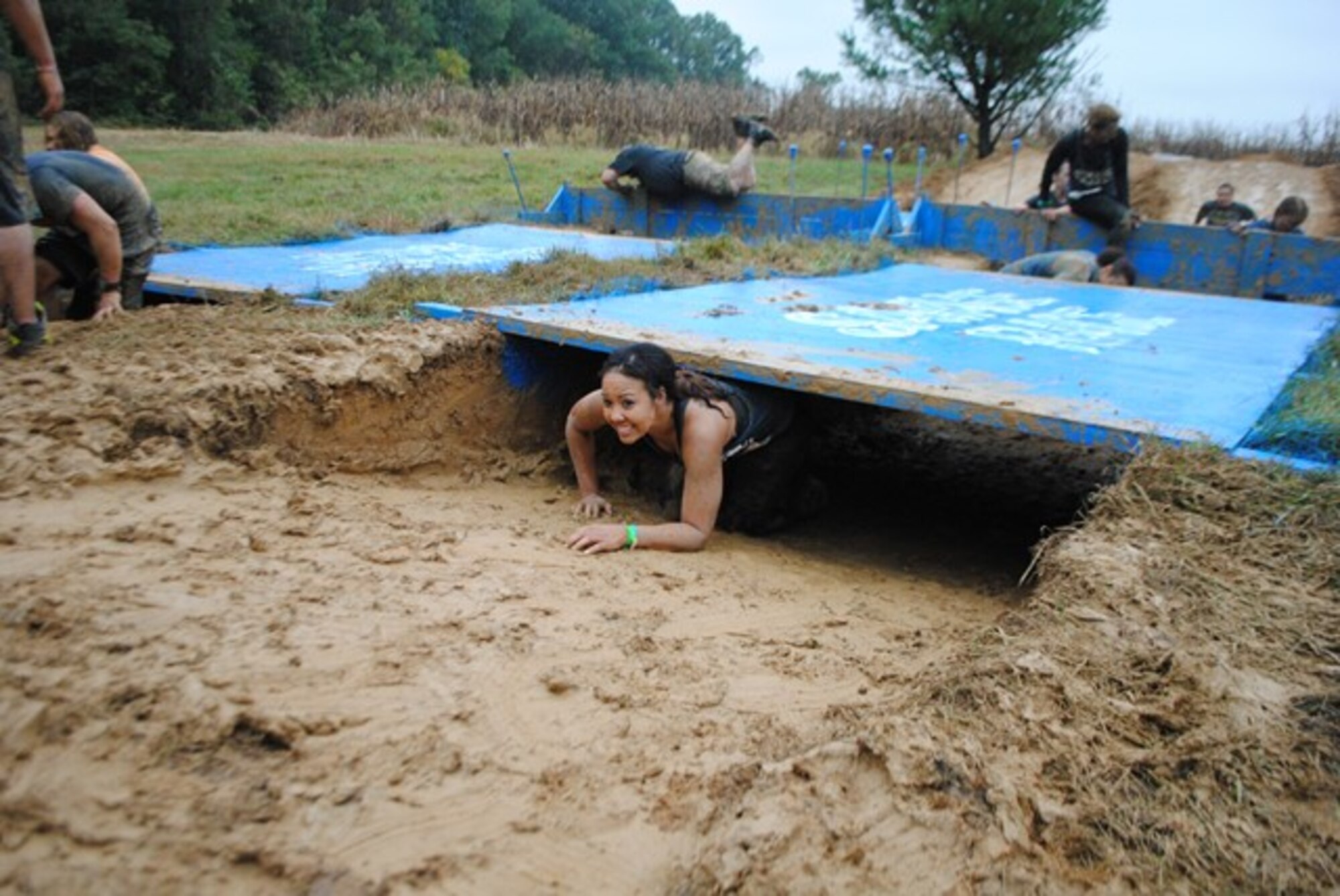 Capt. Michelle Rogers, 512th Maintenance Group executive officer, works her way through an obstacle at the Mid-Atlantic Savage Race Oct. 11, 2014, at Hopkins Farm, Md. The Air Force Reserve was the premiere sponsor for the obstacle race, which was 4-to-6-miles long and had more than 20 obstacles along the way.(Courtesy Photo)