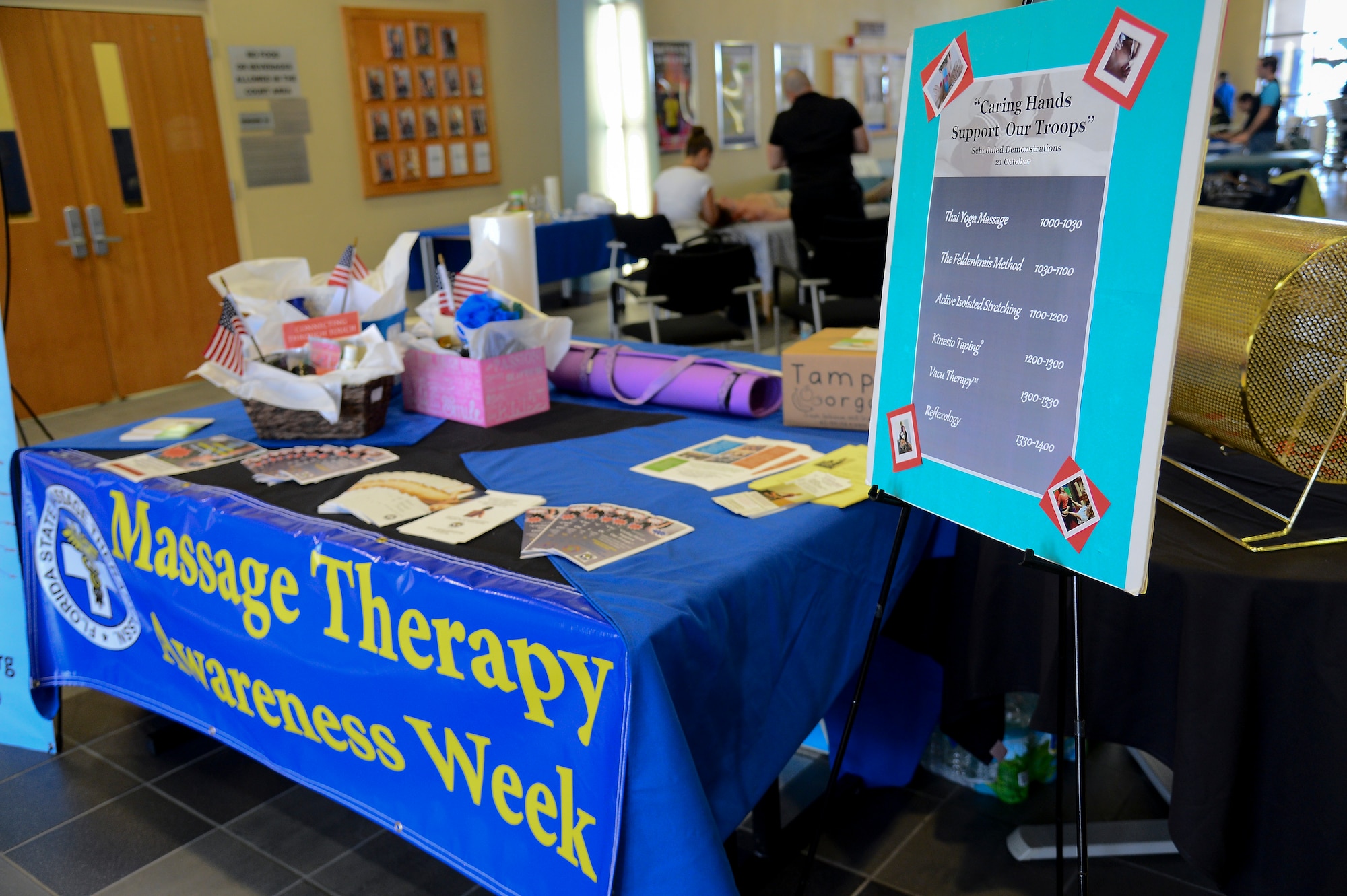 The Health and Wellness Center team up with the Florida State Massage Therapy Association to promote National Massage Therapy Awareness Week at MacDill Air Force Base, Fla., Oct. 21, 2014. This was the 2nd annual “Caring Hands Support Our Troops” event that allowed Team MacDill to experience various forms of massage therapy. (U.S. Air Force photo by Airman 1st Class Danielle Conde/Released)