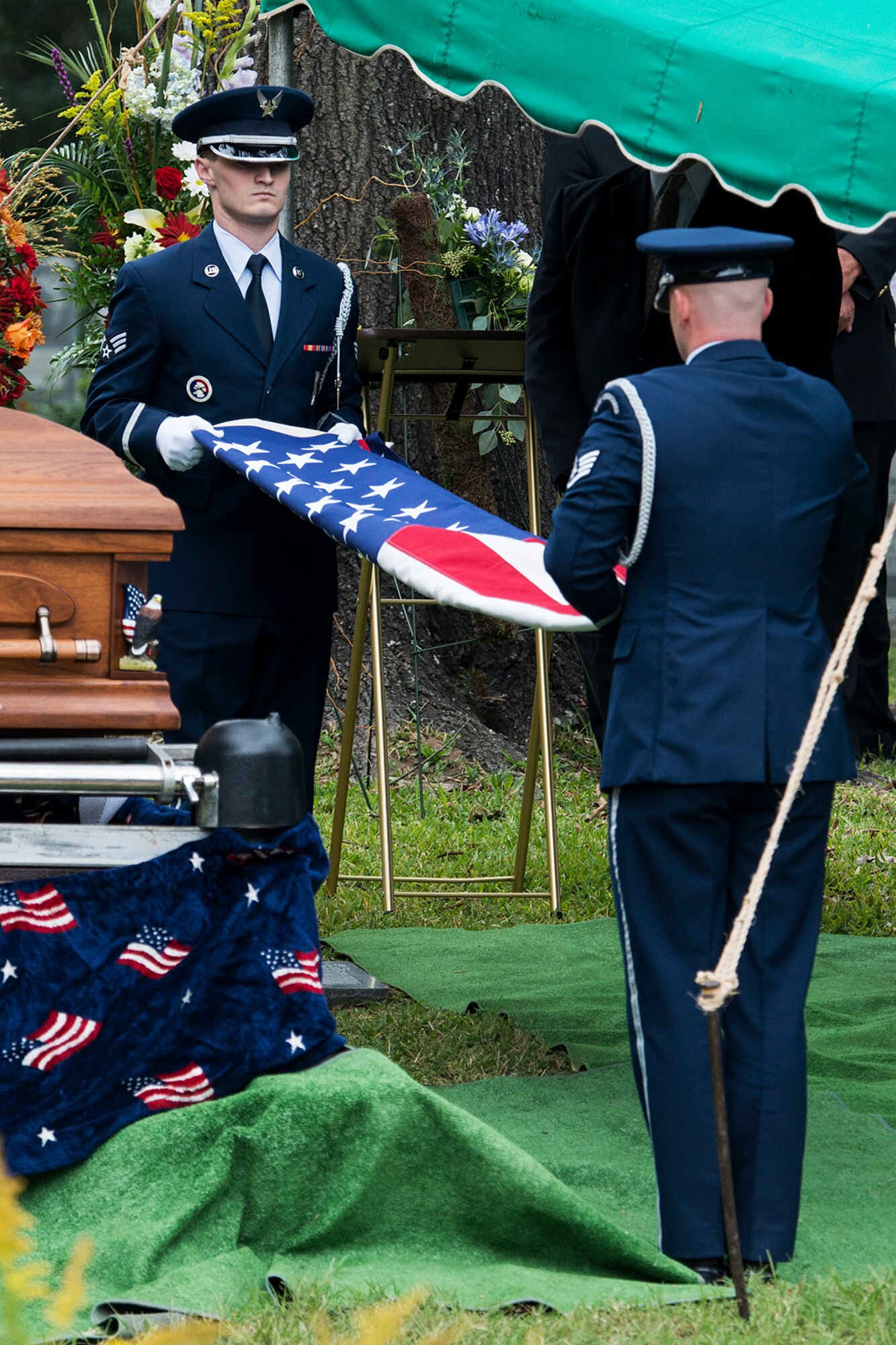 Members of the Barksdale Air Force Base Honor Guard perform a flag ceremony during the funeral service for Claude McCrocklin, Oct. 23, 2014, Shreveport, La. McCrocklin, a World War II B-24 bombardier and Prisoner of War, died Oct. 18, 2014, after a lengthy illness. He was 93. (U.S. Air Force photo by Master Sgt. Greg Steele/Released)