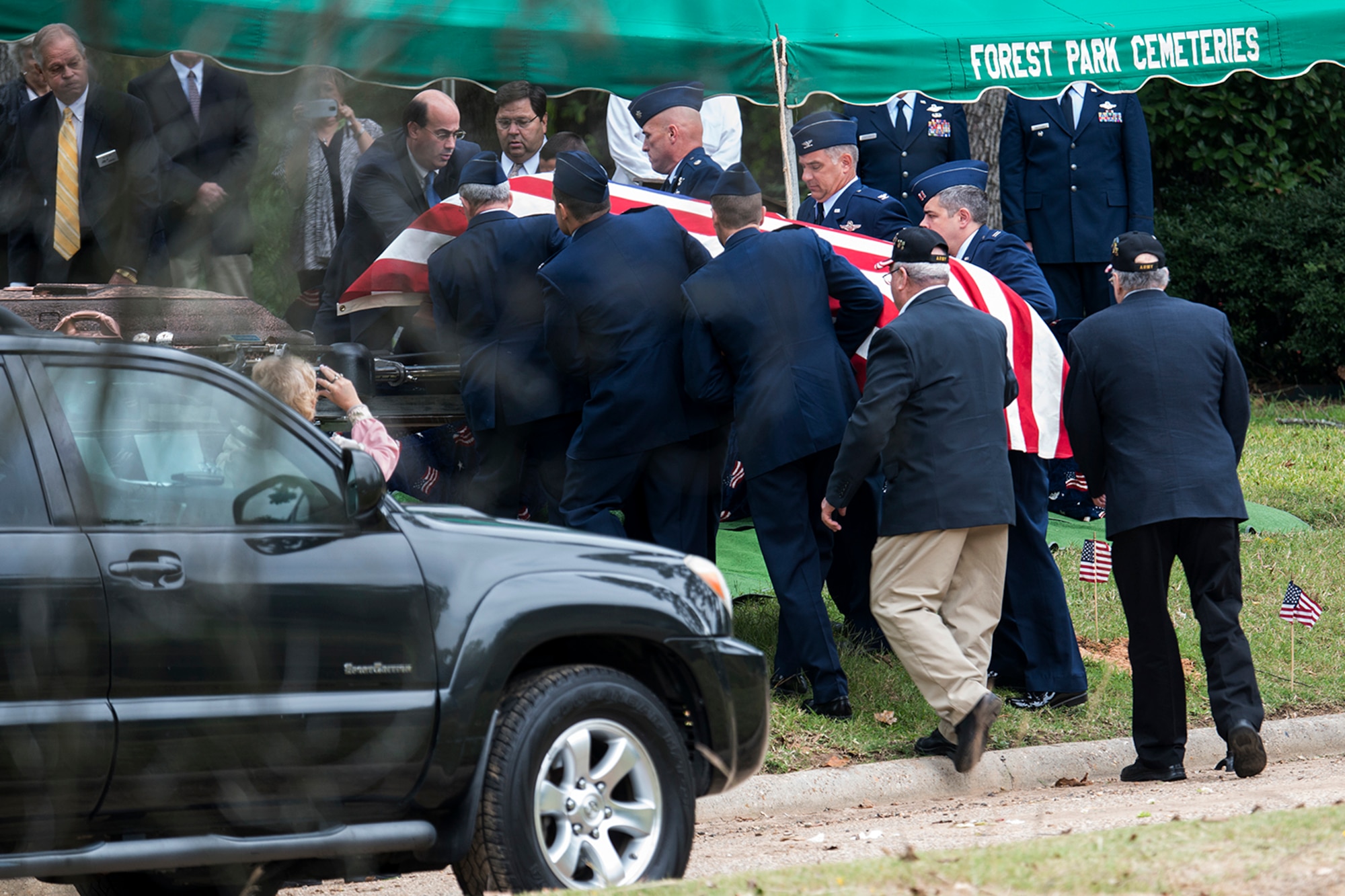 U.S. Air Force Airmen serve as pallbearers during the funeral ceremony for Claude McCrocklin, Oct. 23, 2014, Shreveport, La. McCrocklin, a World War II B-24 bombardier and Prisoner of War, died Oct. 18, 2014, after a lengthy illness. He was 93. (U.S. Air Force photo by Master Sgt. Greg Steele/Released)
