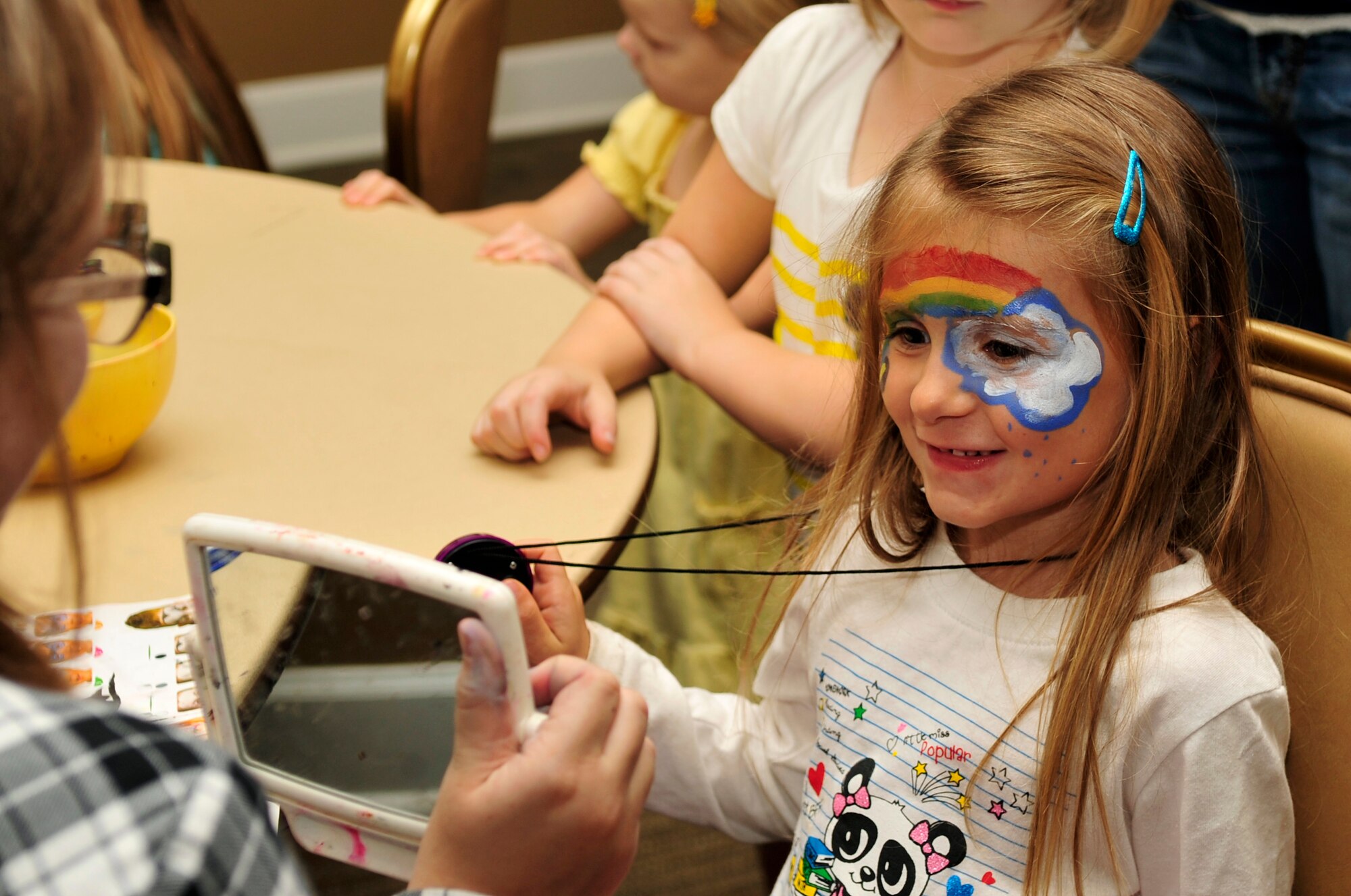 One of Team Seymour’s youngest members gets her face painted during a “Hearts Apart” event Oct. 24, 2014, at Seymour Johnson Air Force Base, North Carolina. The event focused on relieving the pressures families sustain when a member is deployed and served as a venue to ensure families are connected with the wing’s many helping agencies and resources. (U.S. Air Force photo/Airman 1st Class Shawna Keyes)

