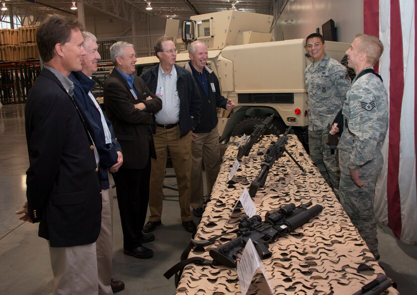 SrA Tyler Arnold and SSgt Aaron Olinski both Security Forces Defenders assigned to the 570 Global Mobility Squadron, interact with Honorary Commander Civic Leaders from various Air Mobility Commands during the Contingency Response Wing's Line of Fire tour. The tour was part of the AMC Civic Leaders Conference. (U.S. Air Force photo by Heide Couch)