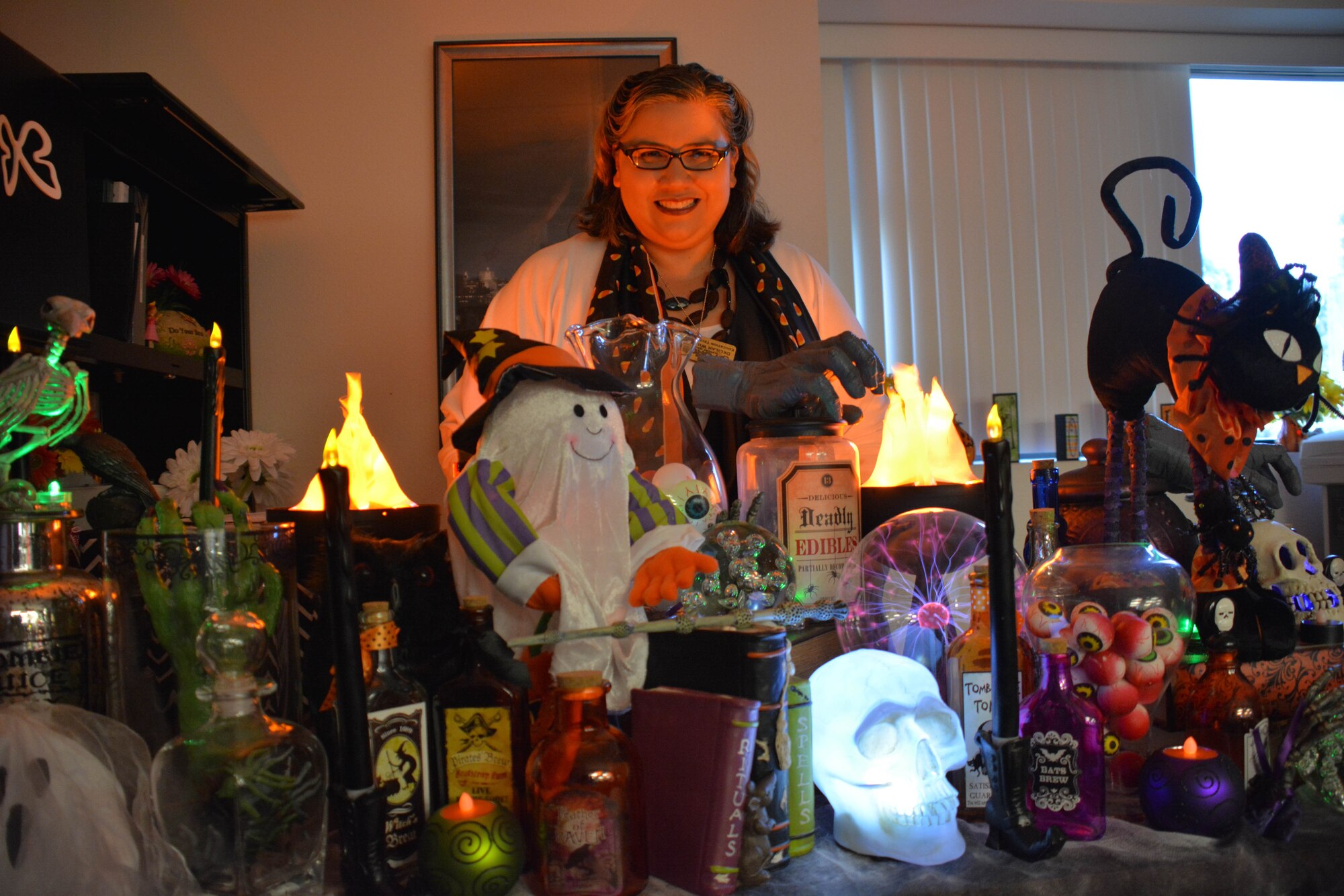 Delilah Wilson, 60th Force Support Squadron Education Center technician, showcases her desk decorated with Halloween items that she has collected over the years Oct. 17 at Travis Air Force Base. (U.S. Air Force photo by Staff Sgt. Christopher Carranza)
