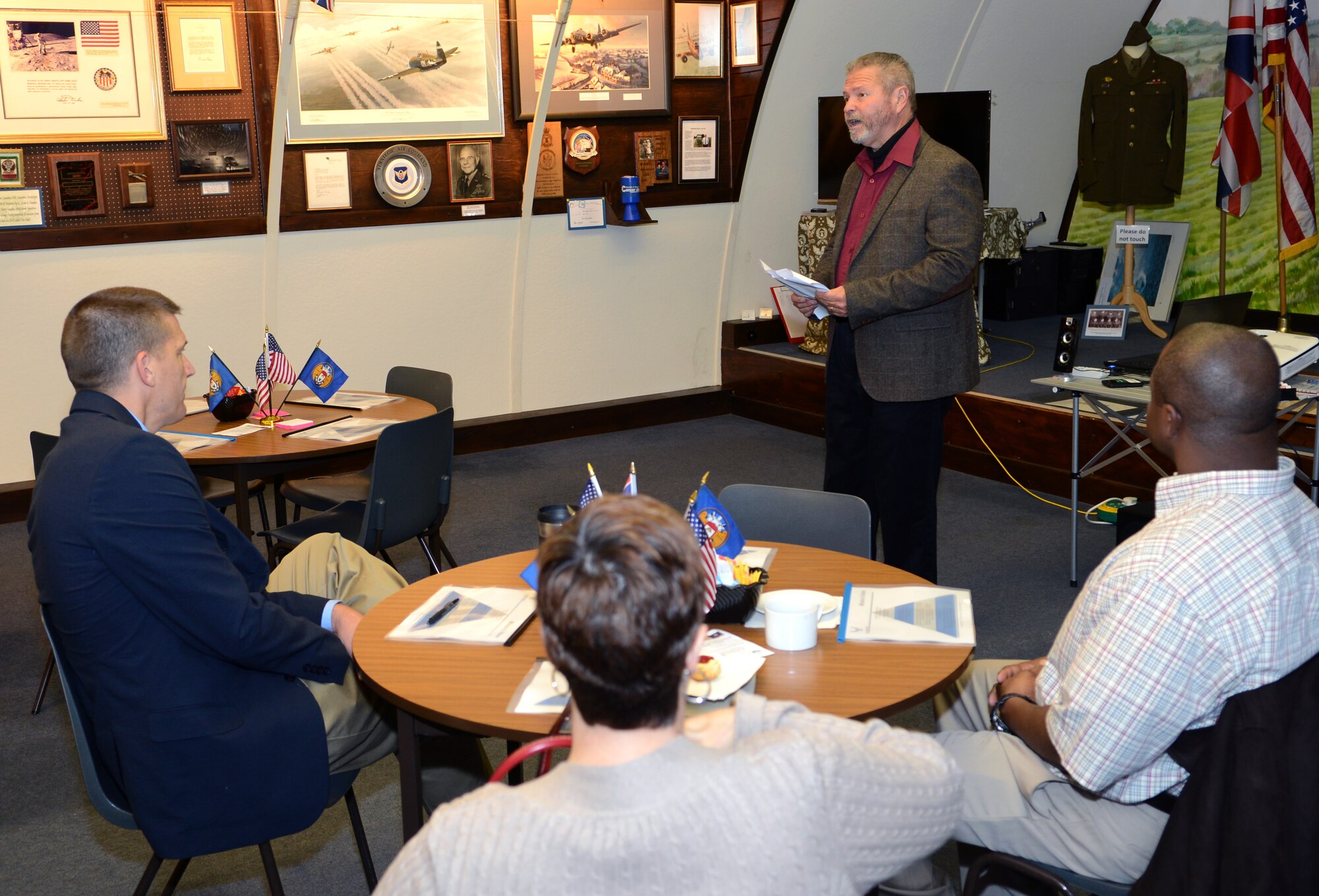 Mark Howell, 100th Air Refueling Wing historian from Odessa, Texas, recounts the story of the Sept. 28, 1944, mission flown by U.S. Army Air Corps 1st Lt. Raymond Harney, B-17 Flying Fortress pilot, and his bombardier U.S. Army Air Corps 2nd Lt. Warren French Oct. 24, 2014, at Thorpe Abbotts near Diss, England. Base leadership traveled to Thorpe Abbotts to return a grave marker originally from Germany memorializing the two Airmen, as well as to discuss wing improvement strategies. (U.S. Air Force photo by Airman 1st Class Dillon Johnston/Released)