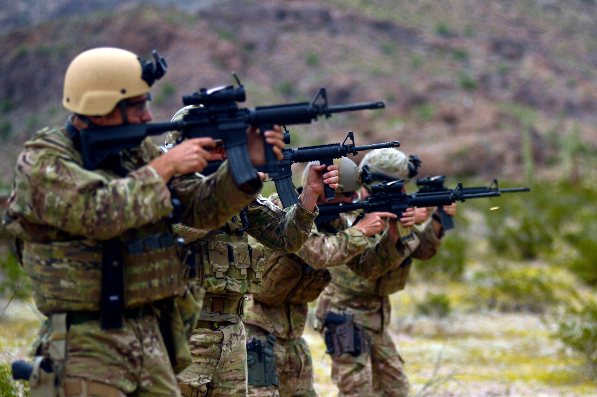 Airmen from Luke Air Force Base and Davis-Monthan AFB conduct a live-fire shooting exercise Oct. 7 through 10 at the Barry M. Goldwater Range during Operation Enduring Training. (U.S. Air Force photo/Airman 1st Class Pedro Mota)