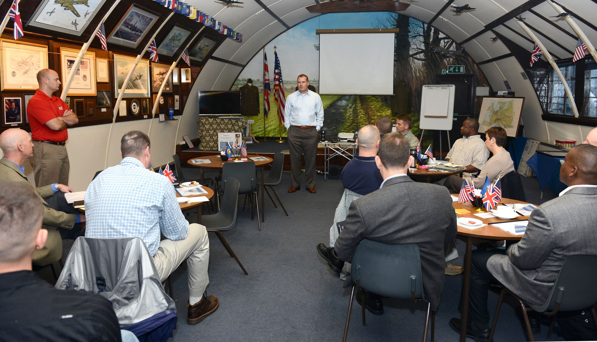 U.S. Air Force Col. Kenneth T. Bibb Jr., center, 100th Air Refueling Wing commander, provides opening remarks to begin a Continuous Process Improvement off-site event Oct. 24, 2014, at Thorpe Abbotts near Diss, England. The event gave commanders and other leaders an opportunity to discuss improvement strategies for the wing and its mission to provide and employ global air refueling, combat support and expeditionary forces. (U.S. Air Force photo by Senior Airman Kate Maurer/Released)