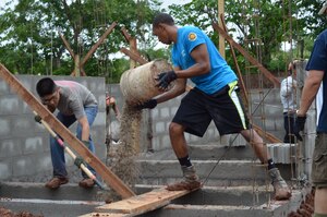 Twenty-seven volunteers from Joint Task Force- Bravo help carry cement blocks and shovel dirt for the foundation of 10 homes during a Habitat for Humanity build in La Paz, Honduras, Oct. 18, 2014.   The homes are the first of 20 homes that will eventually be built in the new La Paz site, and they are expected to be completed by Dec. 20, 2014.  Founded in 1976, Habitat for Humanity is a nonprofit, ecumenical Christian ministry dedicated to building and repairing homes with those in need.  Habitat for Humanity’s work began in Honduras in 1988 and over the years, reached more than 70 communities and served over 15,240 families. (U.S. Air Force Photo/Capt. Connie Dillon)