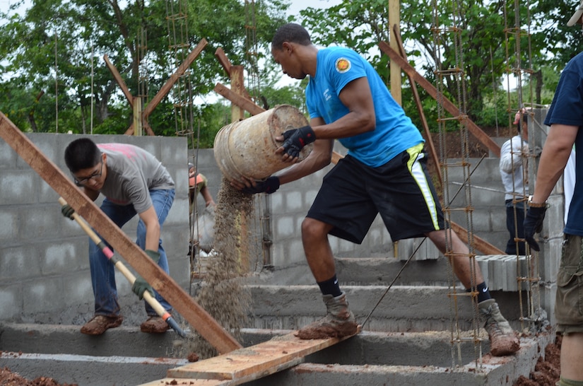 Twenty-seven volunteers from Joint Task Force- Bravo help carry cement blocks and shovel dirt for the foundation of 10 homes during a Habitat for Humanity build in La Paz, Honduras, Oct. 18, 2014.   The homes are the first of 20 homes that will eventually be built in the new La Paz site, and they are expected to be completed by Dec. 20, 2014.  Founded in 1976, Habitat for Humanity is a nonprofit, ecumenical Christian ministry dedicated to building and repairing homes with those in need.  Habitat for Humanity’s work began in Honduras in 1988 and over the years, reached more than 70 communities and served over 15,240 families. (U.S. Air Force Photo/Capt. Connie Dillon)