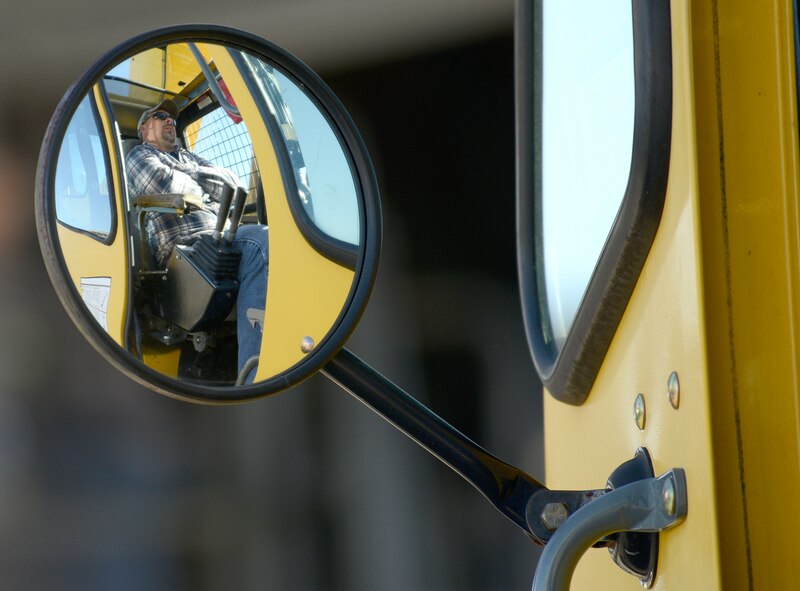 Josh Chance, crane operator, waits for the C-130's tail to be
securely attached before removing it. (U.S. Air Force photo by Ed Aspera)
