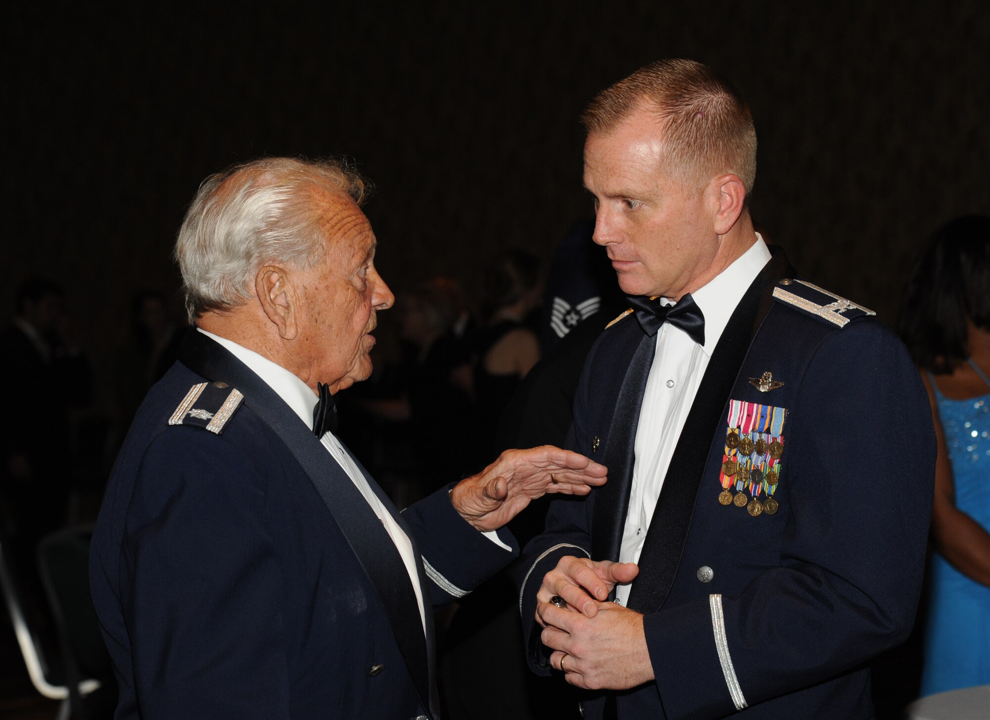 Retired Air Force Lt. Col. Dick Wilson and Col. Dennis Scarborough, 81st Training Wing vice commander, speak during the 36th Annual Salute to the Military Oct. 21, 2014, at the Mississippi Coast Coliseum in Biloxi, Miss.  Master Sgt. Courtney King, Mathies NCO Academy instructor, Keesler Air Force Base, was recognized as the winner of the Thomas V. Fredian Community Leadership Award at the event. (U.S. Air Force photo by Kemberly Groue)