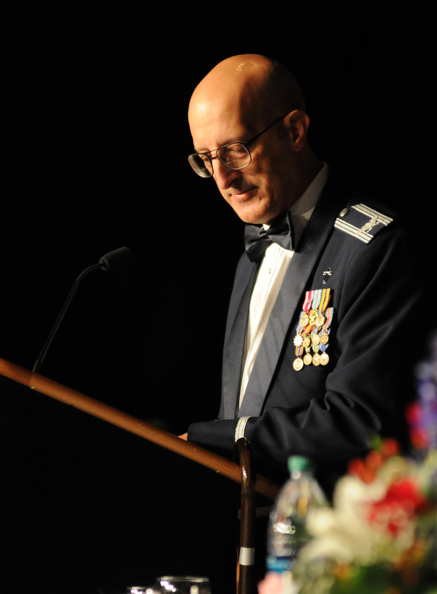 Chaplain (Col.) David Terrinoni, 81st Training Wing, provides the invocation during the 36th Annual Salute to the Military Oct. 21, 2014, at the Mississippi Coast Coliseum in Biloxi, Miss.  Master Sgt. Courtney King, Mathies NCO Academy instructor, Keesler Air Force Base, was recognized as the winner of the Thomas V. Fredian Community Leadership Award at the event. (U.S. Air Force photo by Kemberly Groue)