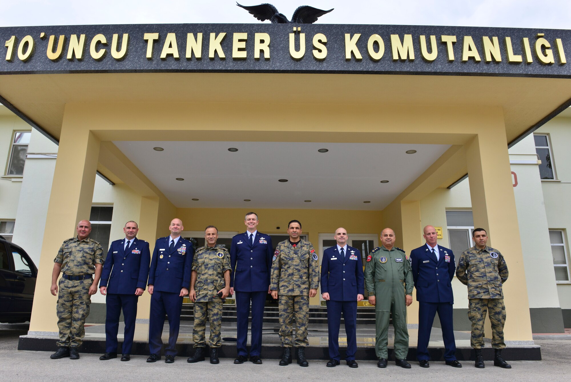 Col. Craig Wills, 39th Air Base Wing commander and Incirlik Air Base staff members pose for a photo after greeting Brig. Gen.  Bekir Ercan VAN incoming 10th Tanker Base commander Oct. 22, 2014, Incirlik Air Base, Turkey.  VAN is serving his second tour at the 10th TBC after being assigned here in 2011-2012. (U.S. Air Force photo by Senior Airman Nicole Sikorski/Released)