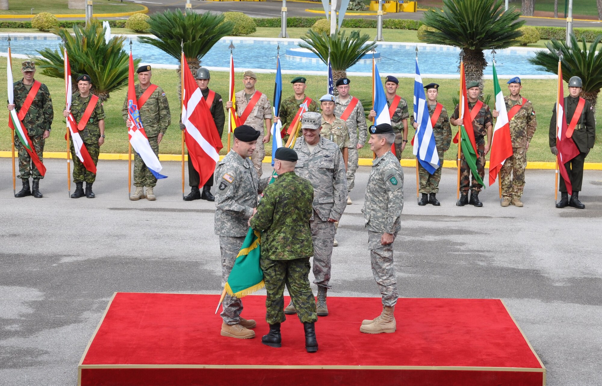 U.S. Army Lt. Gen. Ben Hodges (left), outgoing NATO Headquarters Allied Land Command commander, receives the guidon from Canadian Army Chief Warrant Officer Daniel Moyer, NATO Headquarters Allied Land Command Command Sgt. Maj., as he relinquishes command of the NATO Headquarters Allied Land Command during a change of command ceremony at the NATO General Vecihi Akın Garrison Oct. 23, 2014, Izmir, Turkey. (U.S. Air Force photo by Tanju Varlıklı)
