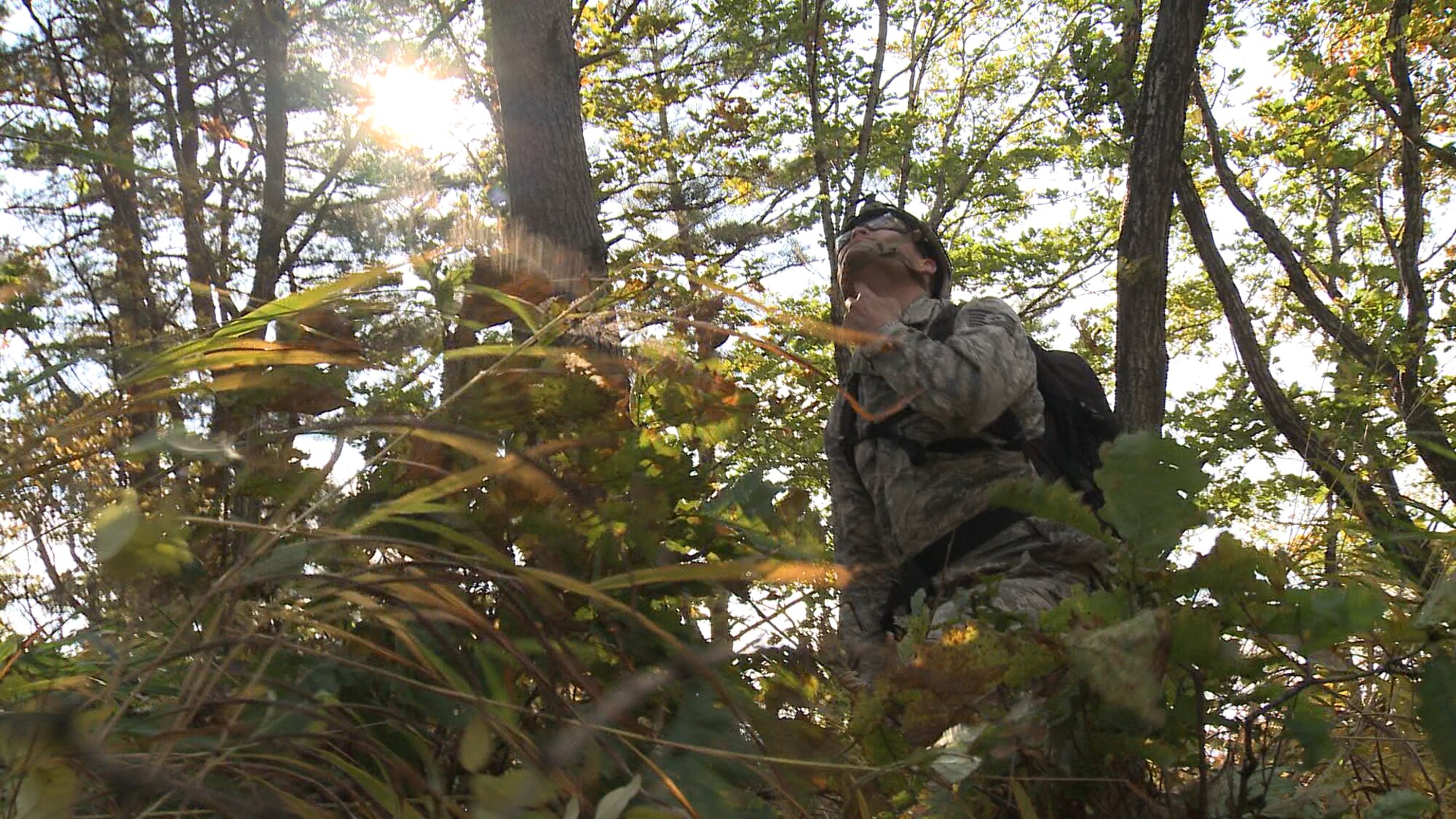 Tech. Sgt. Jeffrey Farris, 5th Reconnaissance Squadron quality assurance chief inspector, waits as a harness is lowered for him from an HH-60G Pave Hawk helicopter Oct. 16, 2014, during a combat search and rescue training scenario at an off base training site, Republic of Korea. Multiple A-10 Thunderbolt IIs helped locate the isolated personnel, suppressed any simulated threats in the area and escorted the helicopters out of the objective area. (U.S. Air Force photo by Senior Airman Lindy Pata)