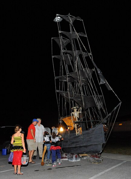 Air Commando children admire a pirate ship at a Trunk-N-Treat event on Hurlburt Field, Fla., Oct. 17, 2014. The 1st Special Operations Maintenance Group hosted the family-oriented event to boost morale and to get into the Halloween spirit. (U.S. Air Force photo/Airman 1st Class Andrea Posey)