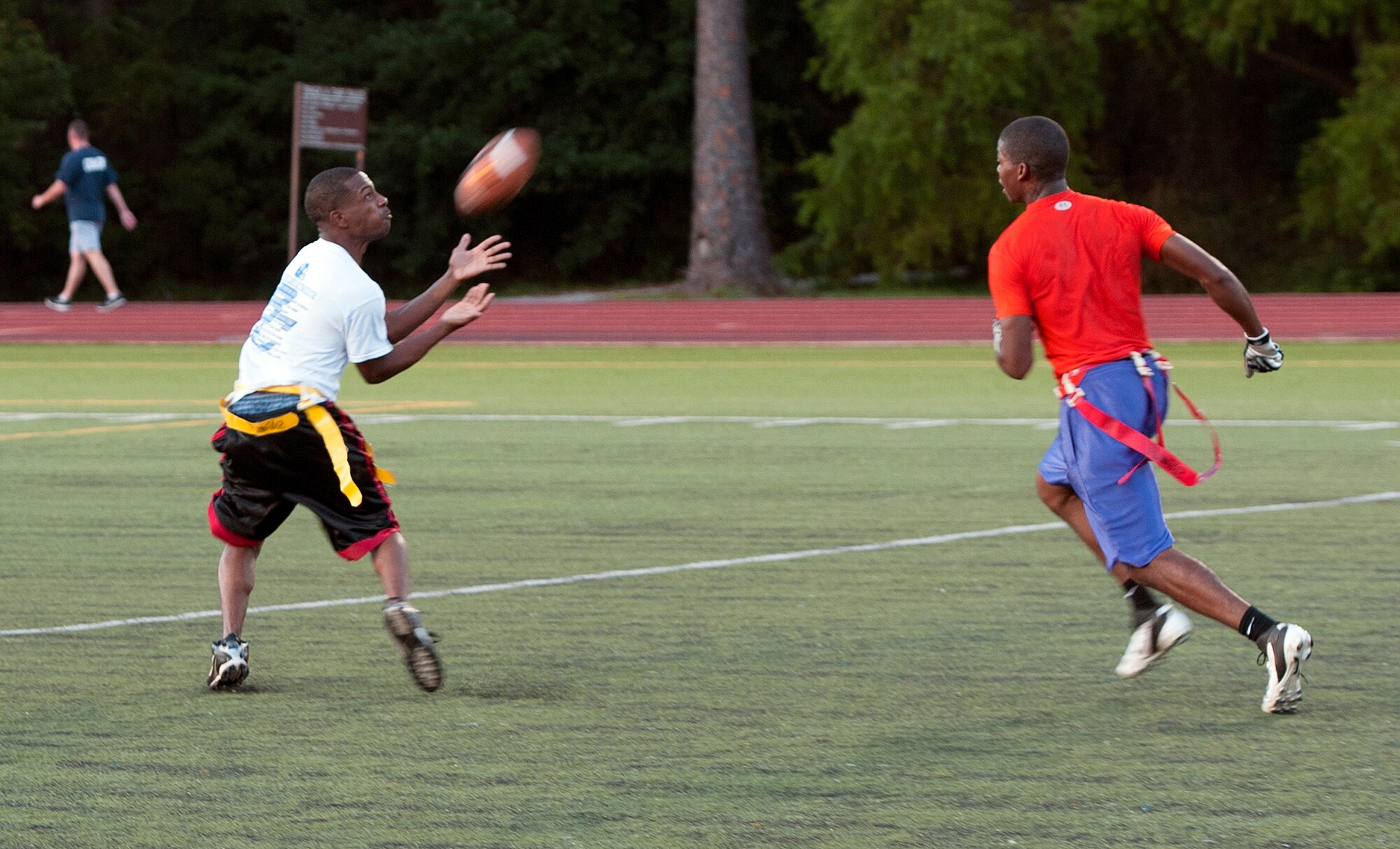 Al Sapp, 1st Special Operations Maintenance Group safety, intercepts a pass attempt during an intramural flag football game on Hurlburt Field, Fla., Oct. 21, 2014. The 1st SOMXG defeated the 1st Special Operations Force Support Squadron in overtime, 30-24. (U.S. Air Force photo/Senior Airman Kentavist P. Brackin)