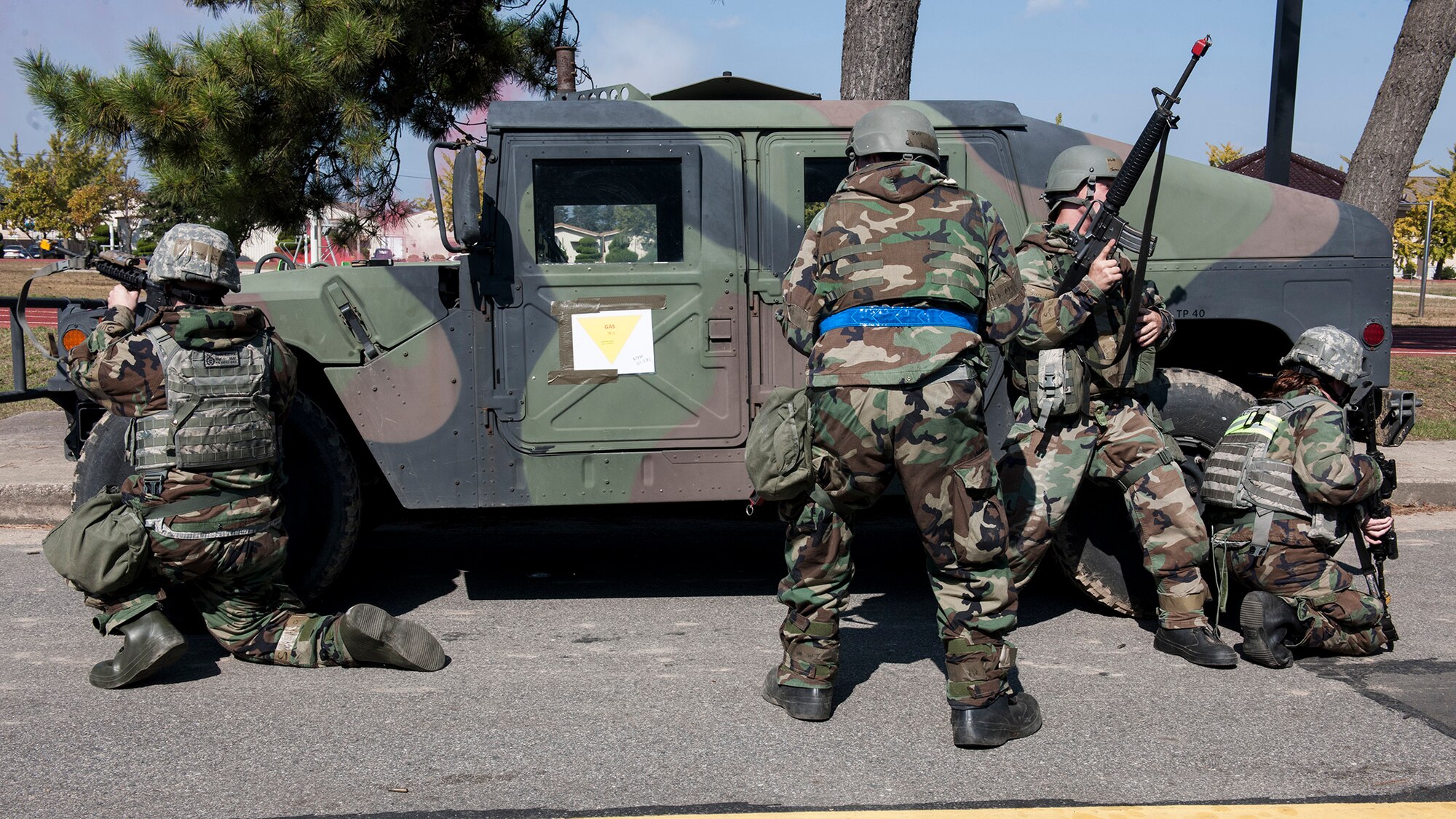 Defenders from the 8th Security Forces Squadron simulate firing upon opposing forces during Exercise Beverly Midnight 15-1, Oct. 23, 2014. The four-day exercise demonstrated the Wolf Pack's ability to work alongside Republic of Korea air force allies as well as their capability of responding to wartime and armistice threats. (U.S. Air Force photo by Senior Airman Katrina Heikkinen/Released)