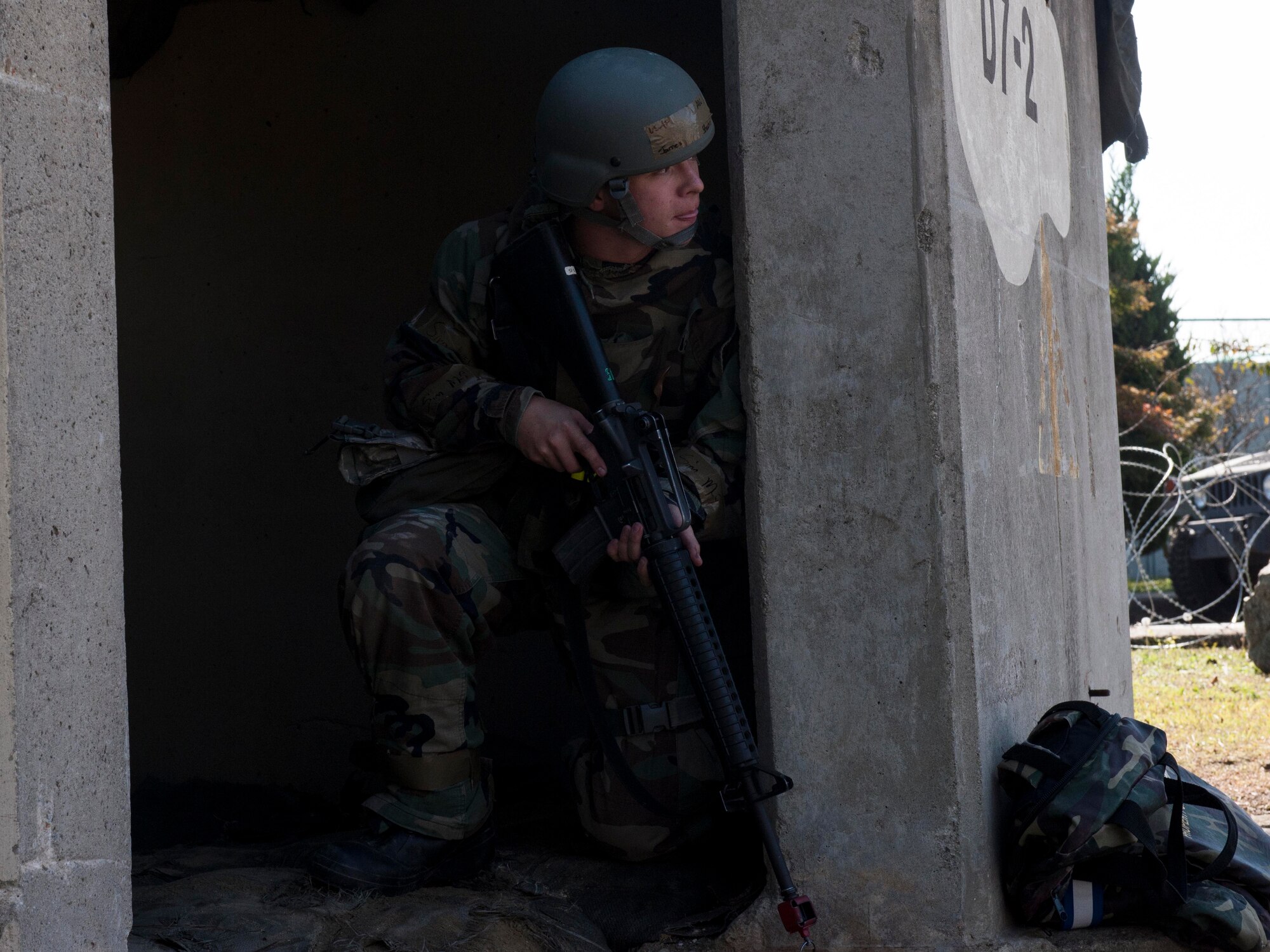 An Airman provides security at an entry control point during Exercise Beverly Midnight 15-1, Oct. 23, 2014. The four-day exercise demonstrated the Wolf Pack's ability to work alongside Republic of Korea air force allies as well as their capability of responding to wartime and armistice threats. (U.S. Air Force photo by Senior Airman Katrina Heikkinen/Released)